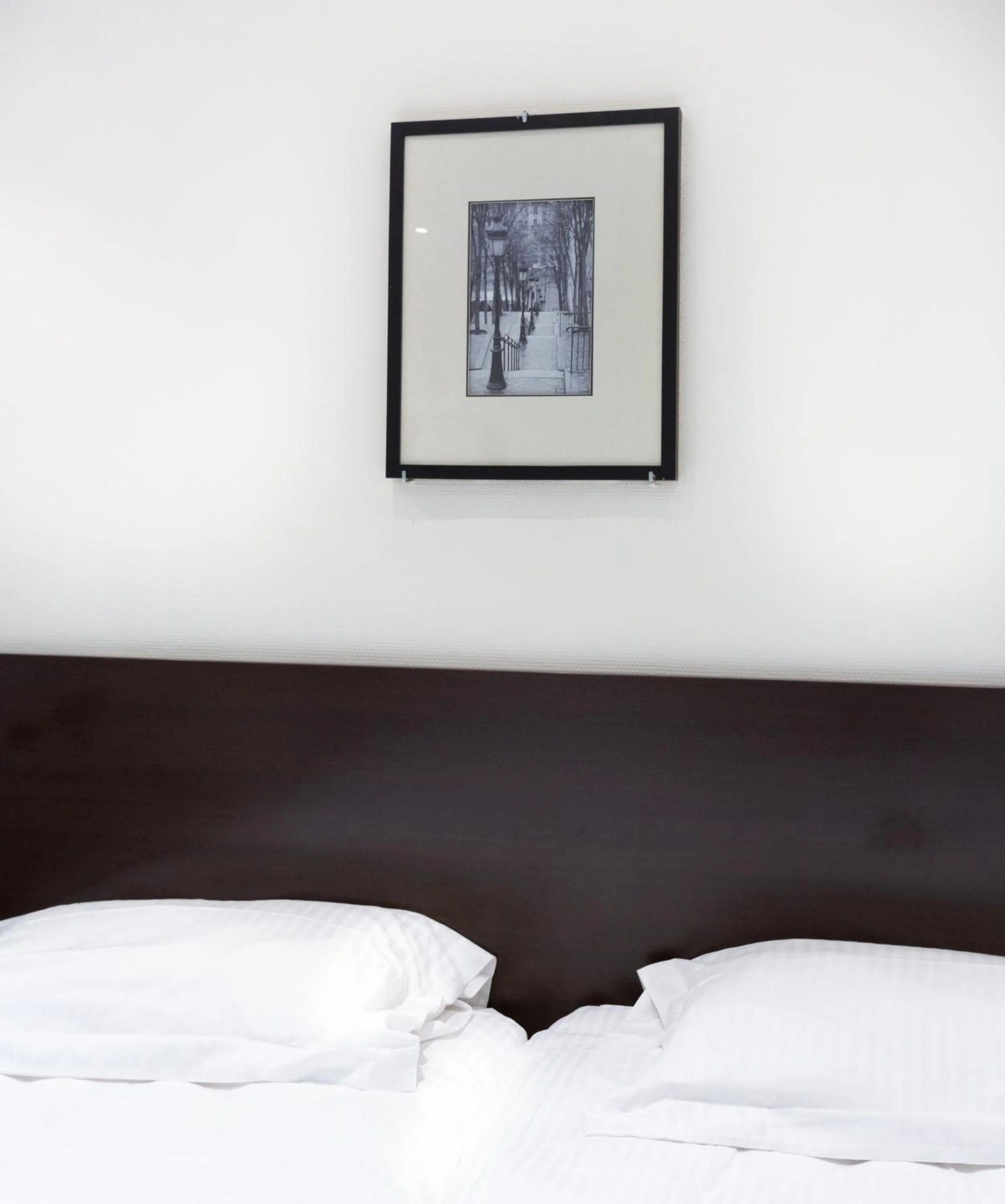 Decorative detail, Bed in Hotel Mimosa Paris