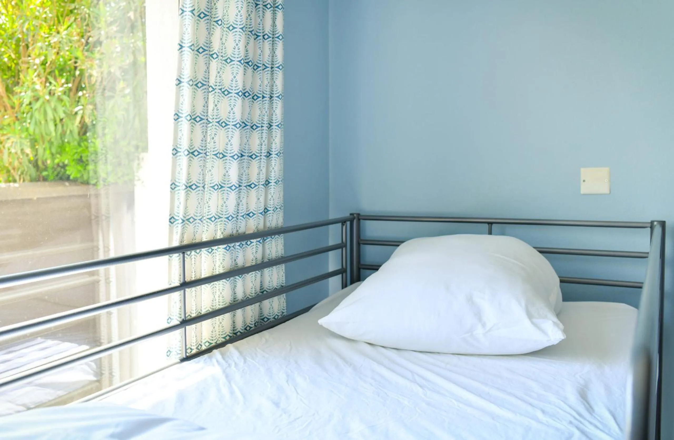 Bed in Single Fin Hotel & Lodge