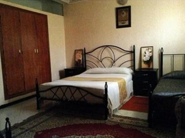 Bedroom in Hôtel Tijani