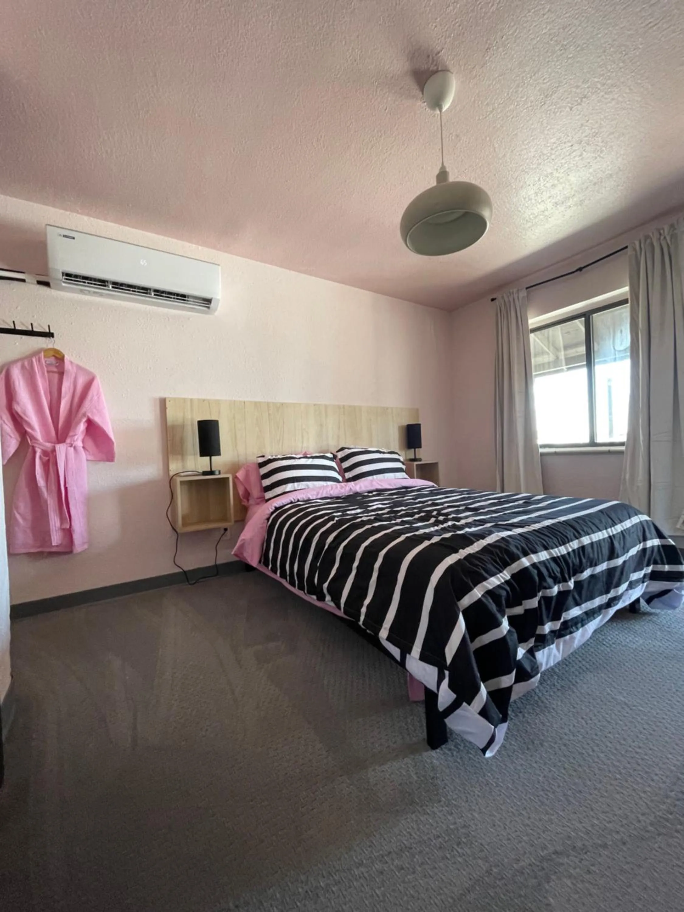 Bed in Rainbow Motel