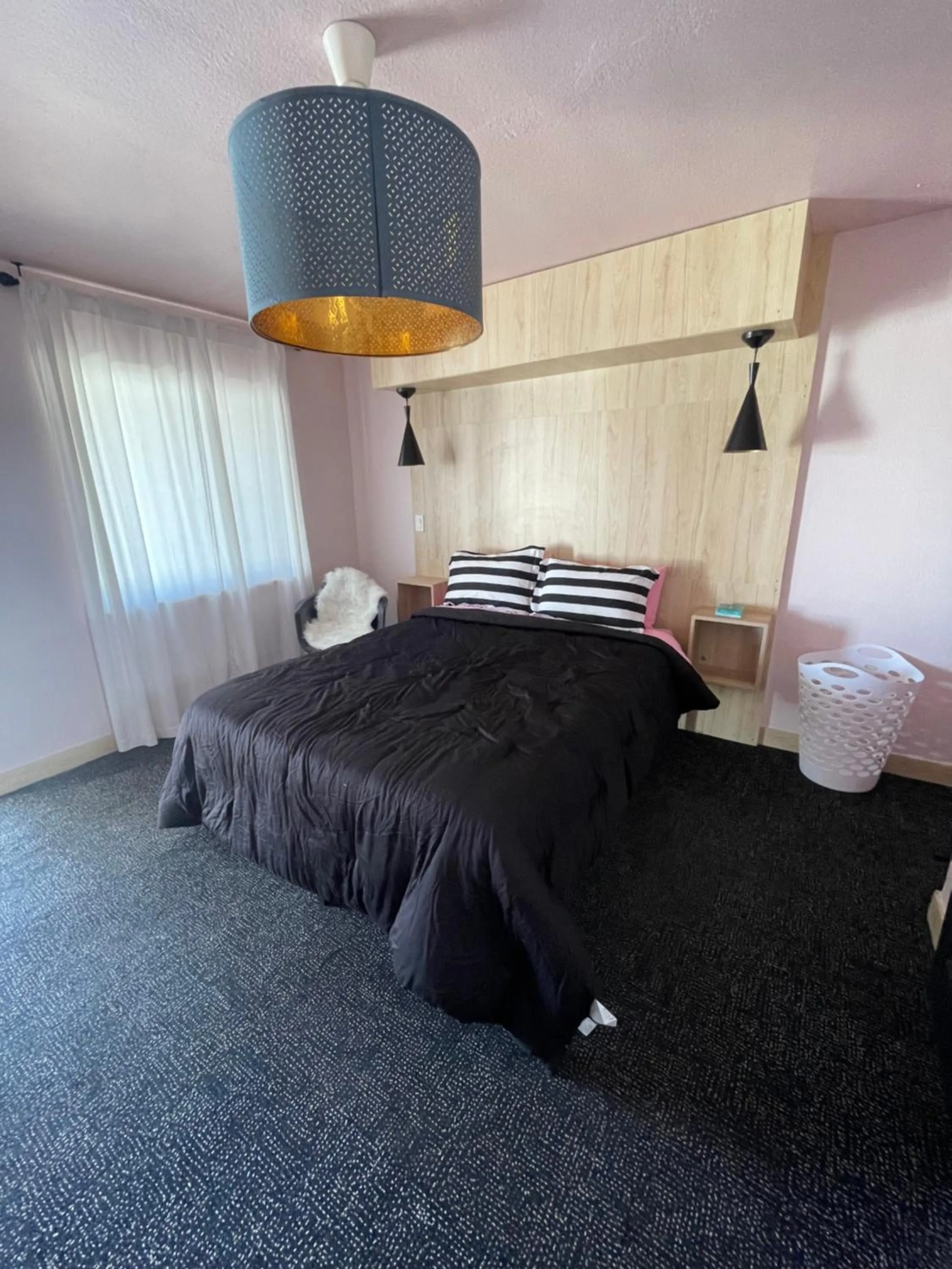 Bed in Rainbow Motel