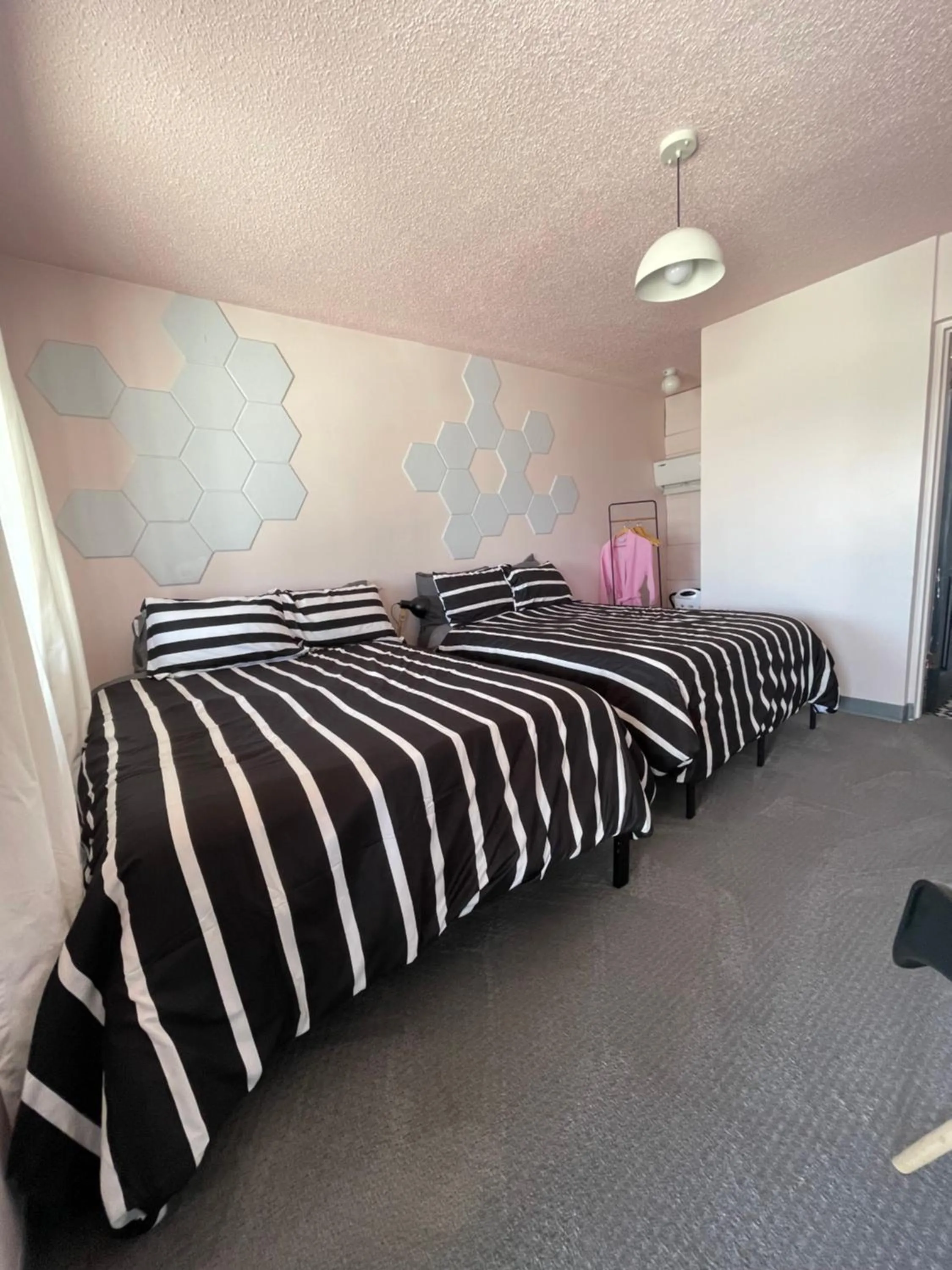 Bed in Rainbow Motel