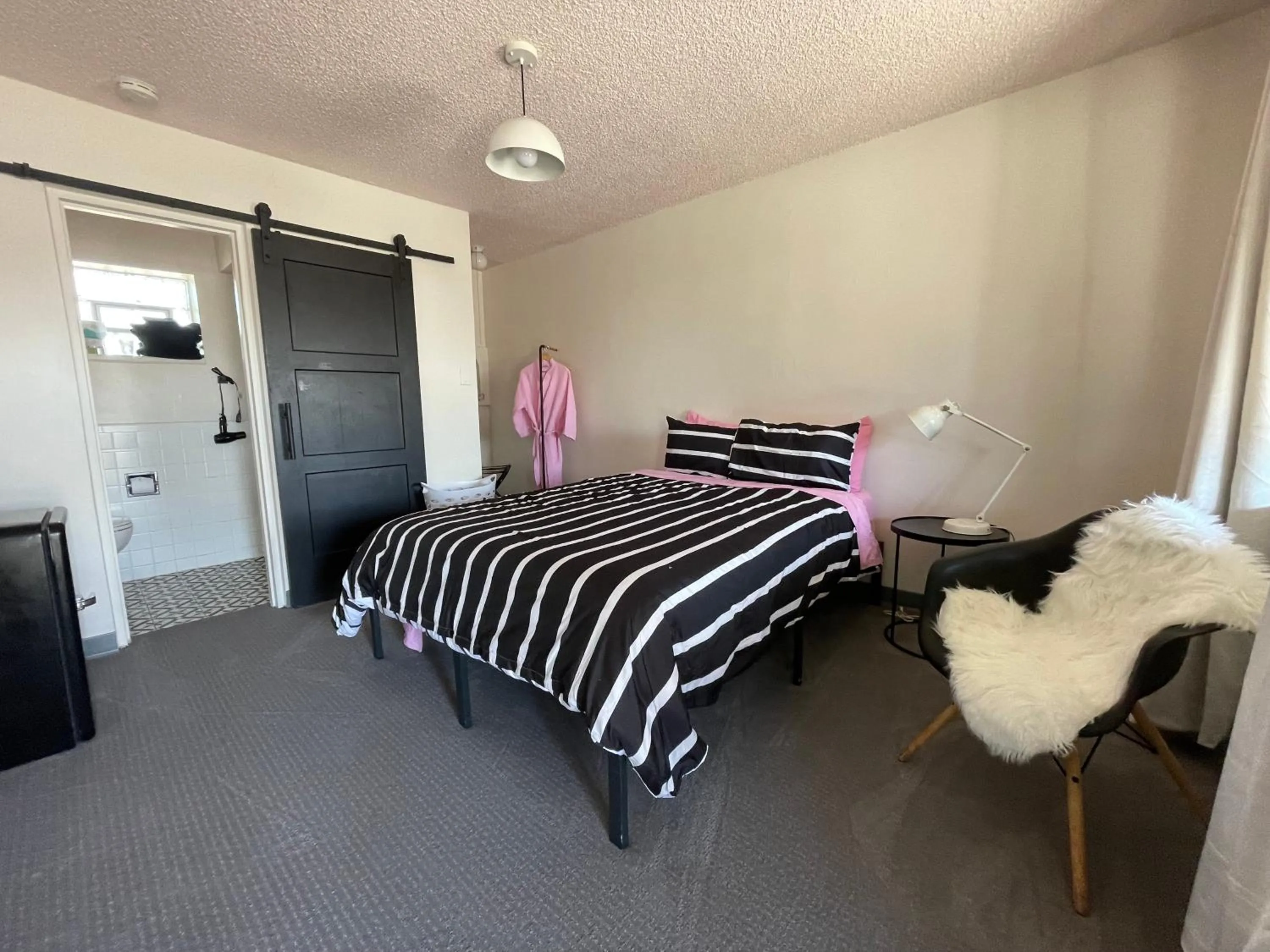 Bed in Rainbow Motel