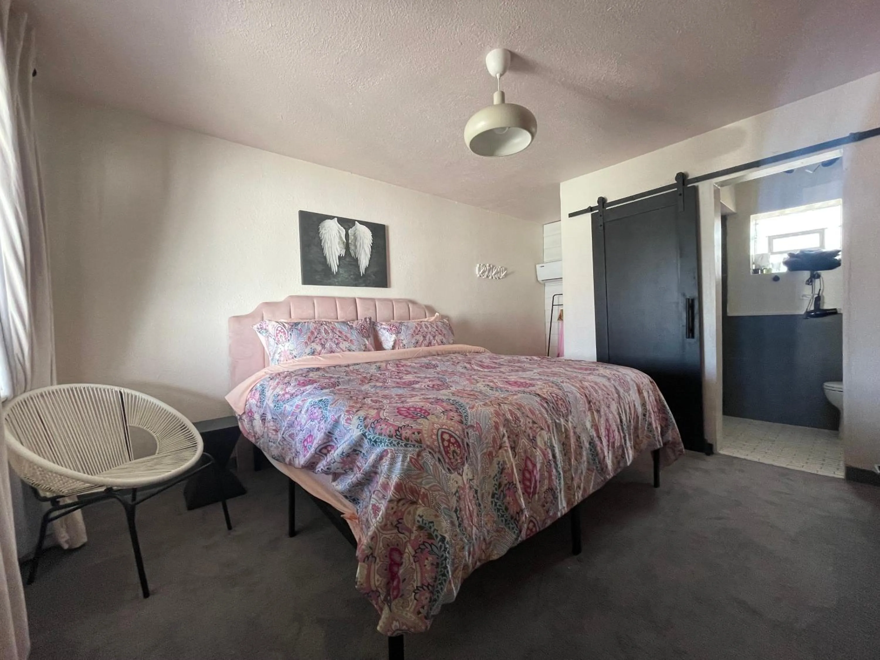 Bed in Rainbow Motel