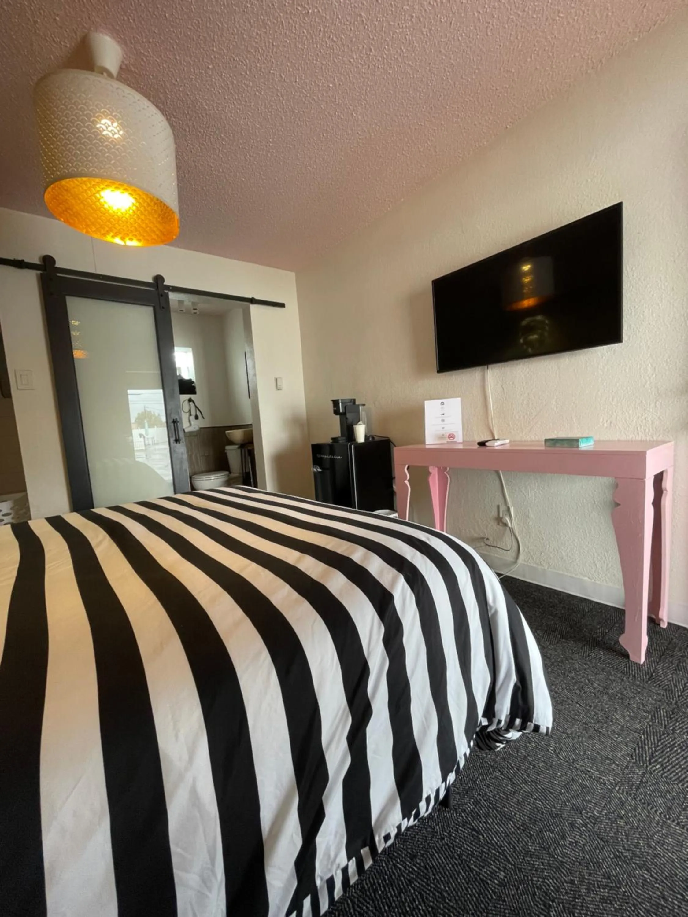 Bed in Rainbow Motel