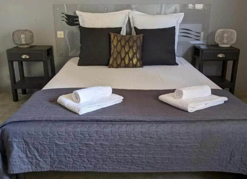 Bed in Hôtel Studios Les Acacias