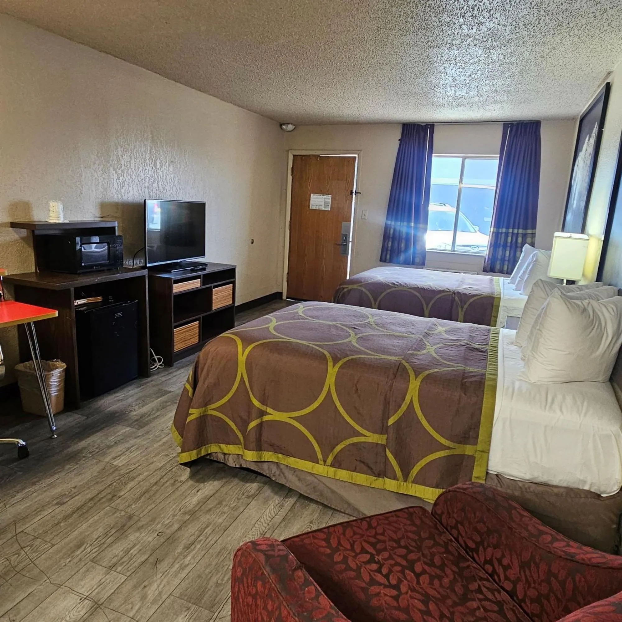Communal lounge/ TV room, Bed in Super 8 by Wyndham Denver Central