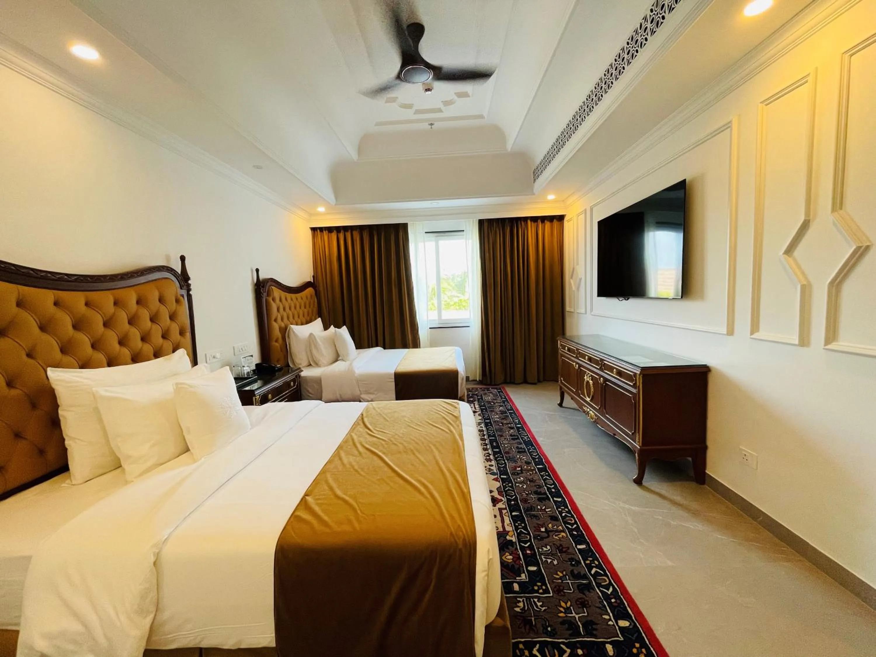 Bed in Mayfair Palm Beach Resort