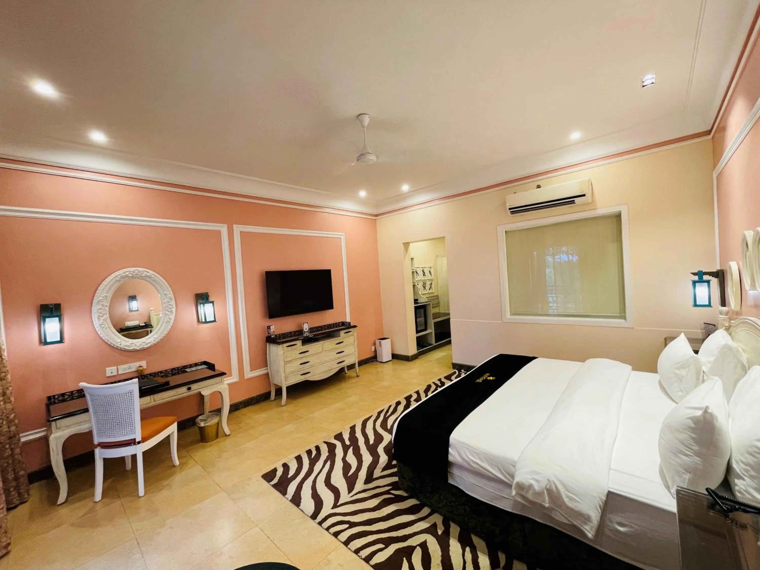 Seating area, Bed in Mayfair Palm Beach Resort