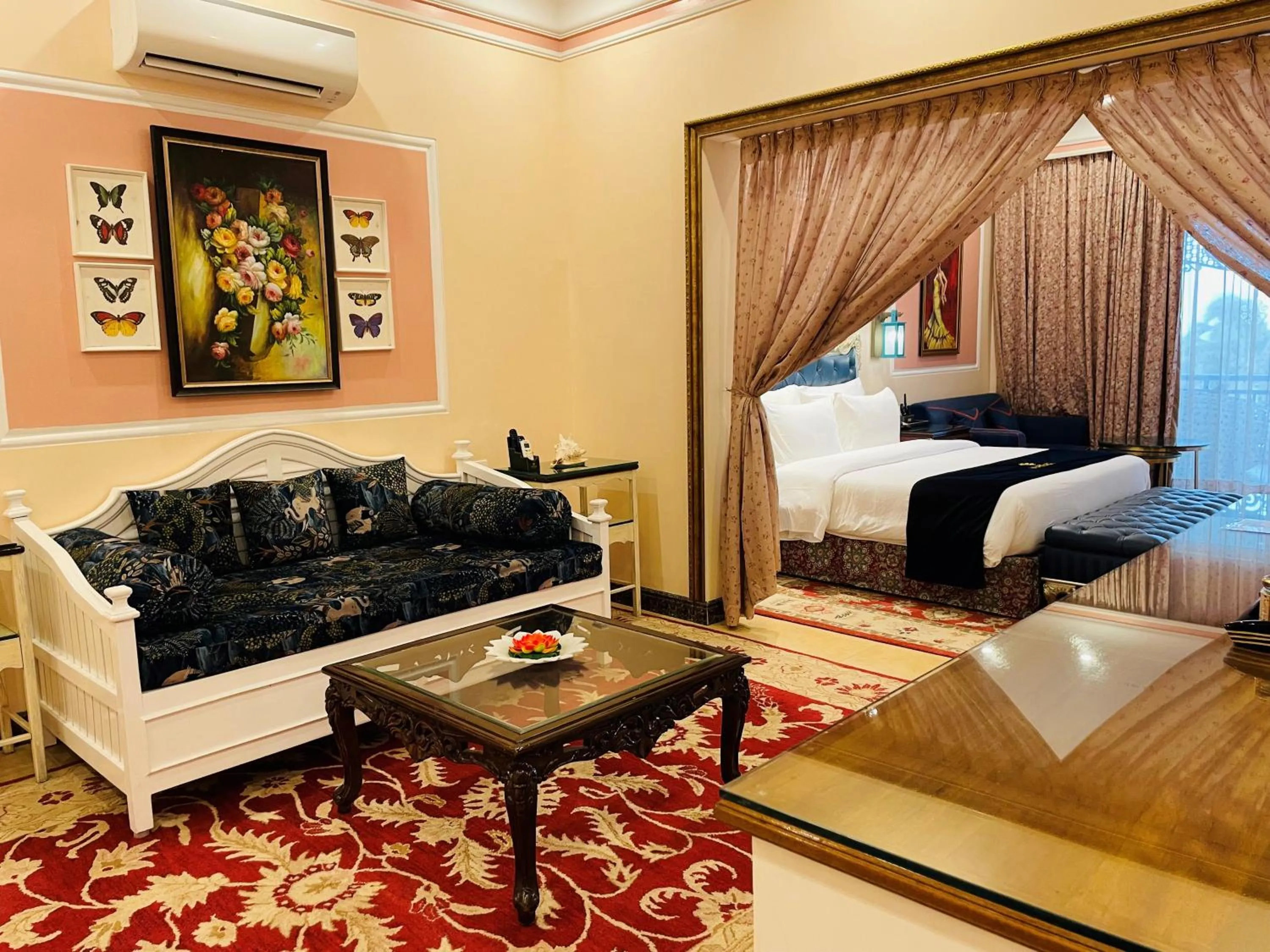 Living room, Bed in Mayfair Palm Beach Resort