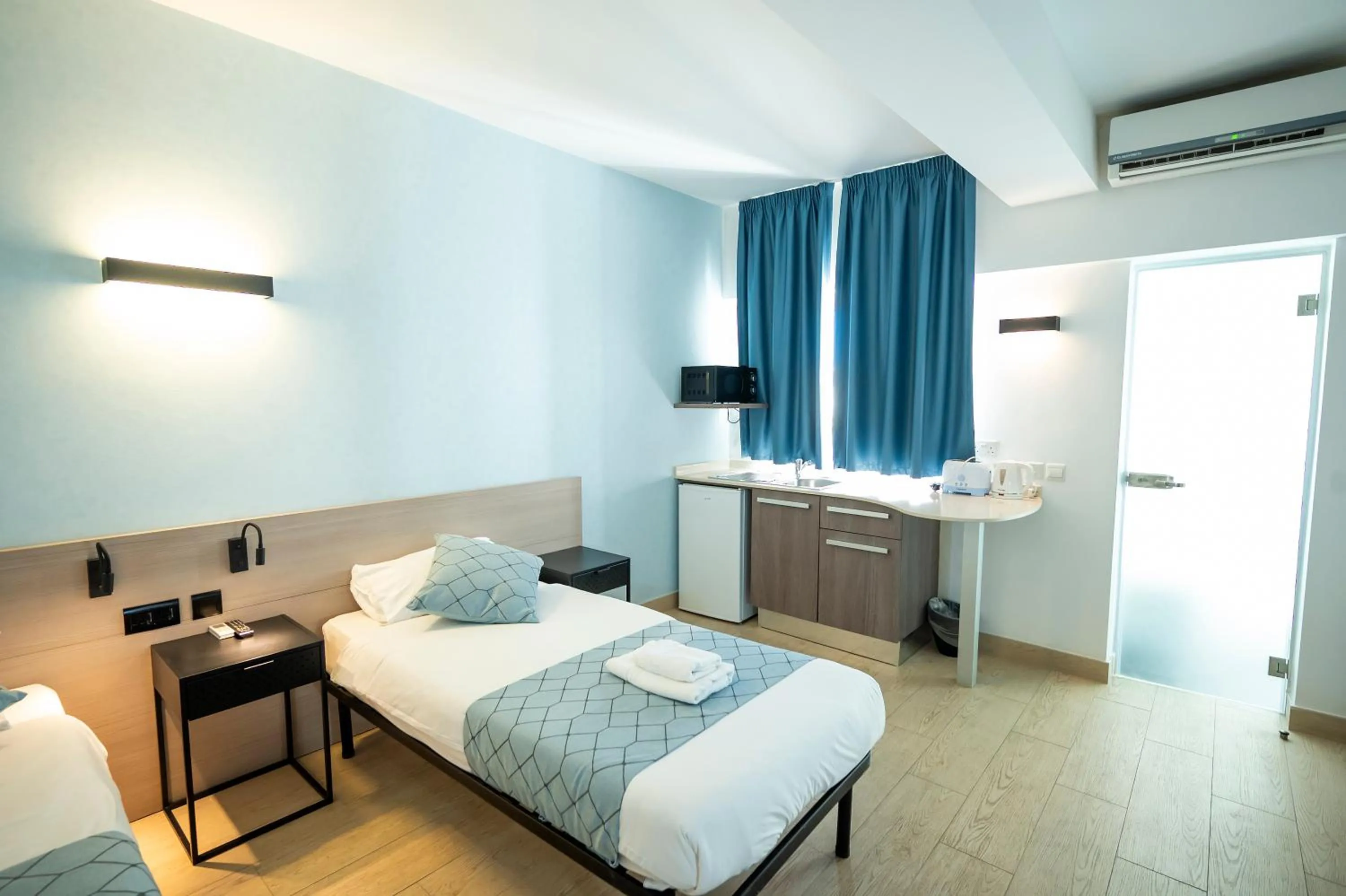 Bed in Day's Inn Hotel and Residence