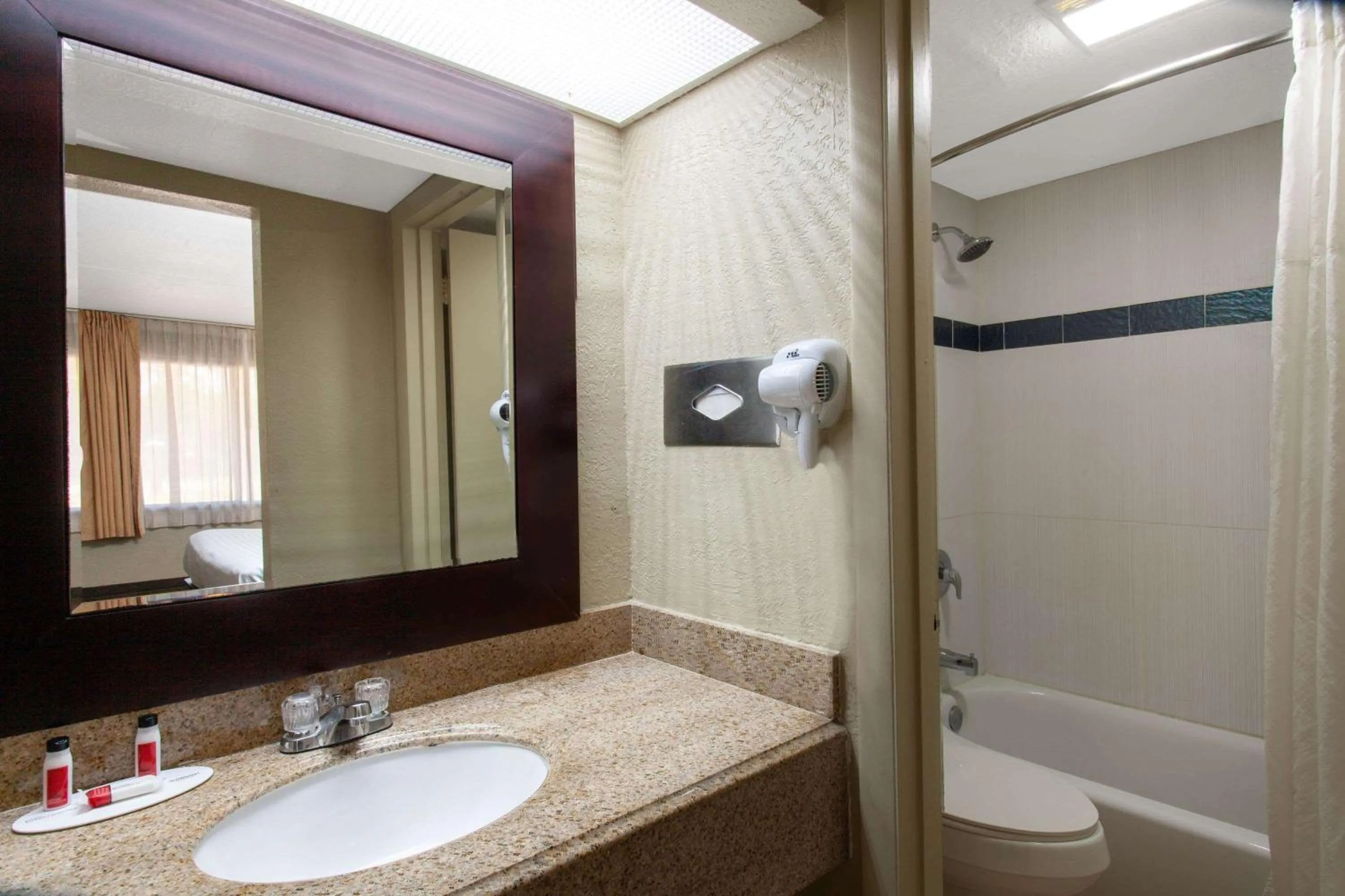 Bathroom in Travelodge by Wyndham Deltona