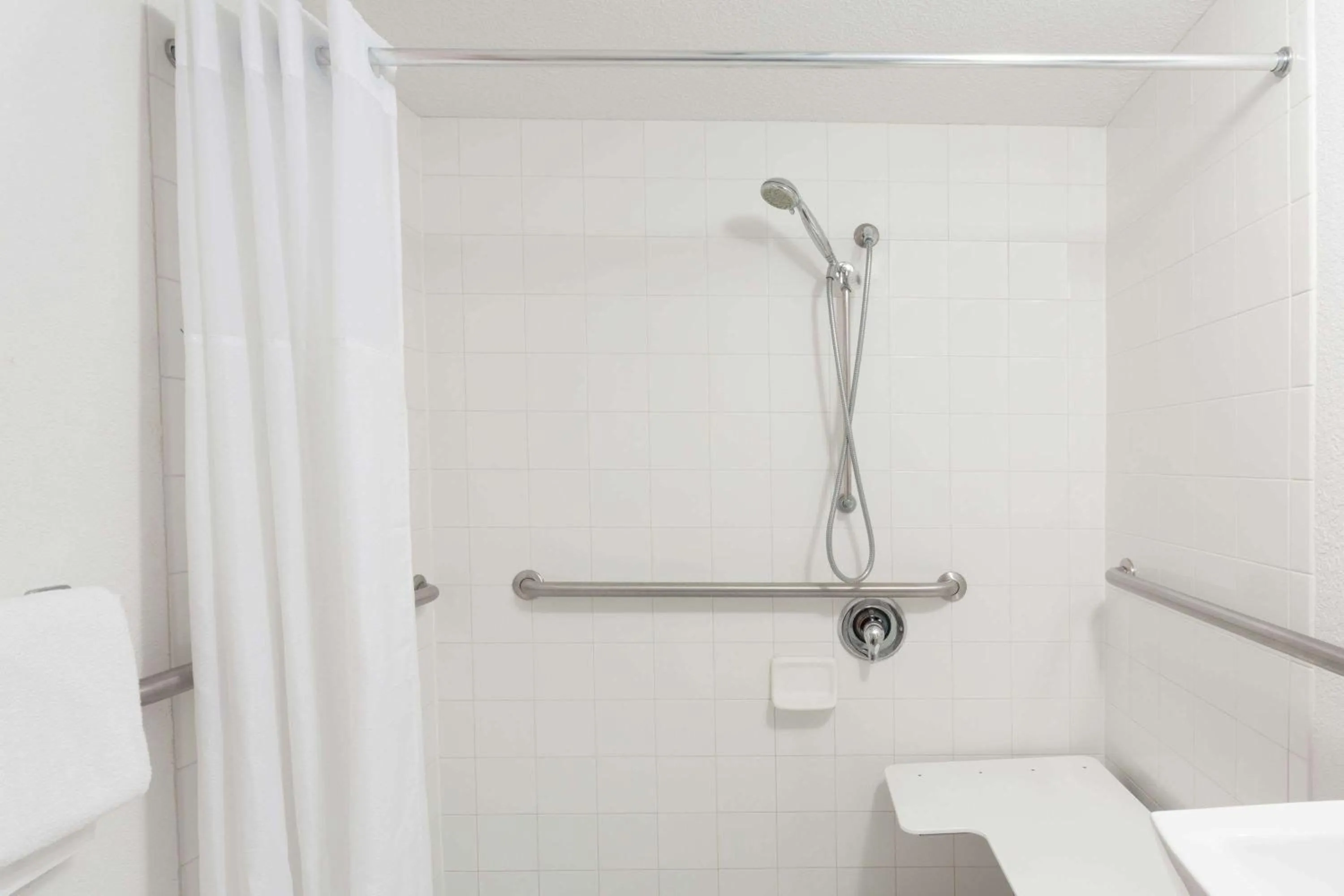 Bathroom in Travelodge by Wyndham Deltona