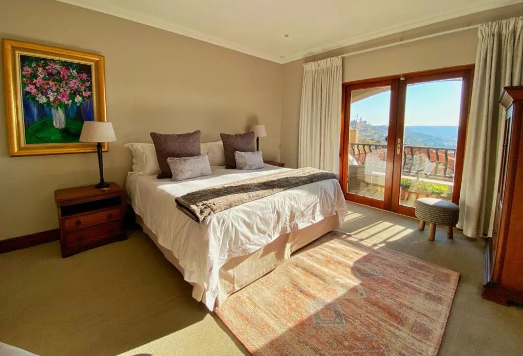 Bed in The Northcliff Boutique Hotel