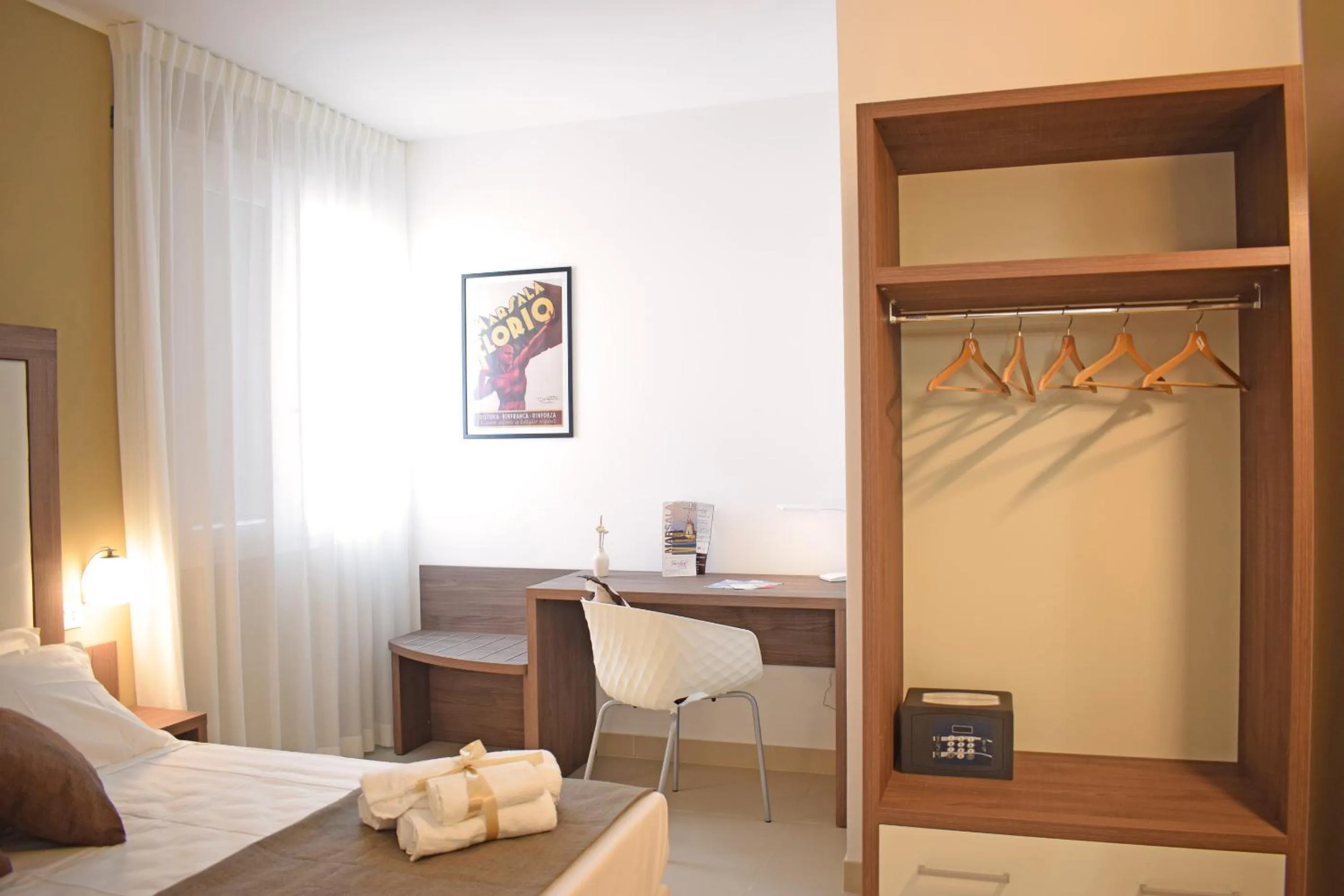 Bed in Travini Hotel Residence