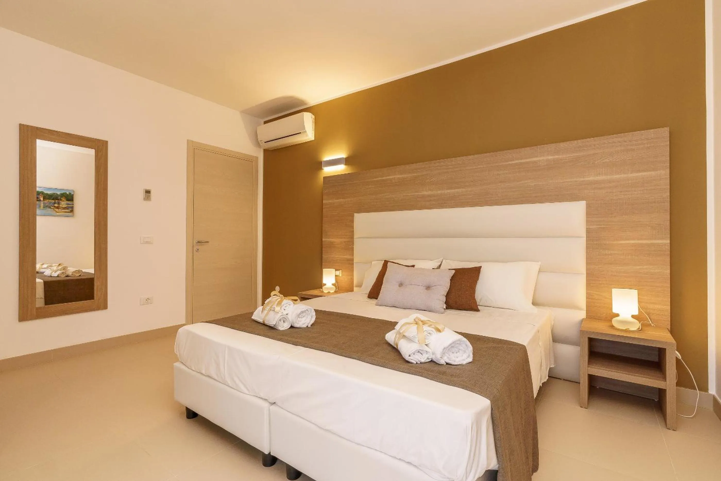 Bed in Travini Hotel Residence