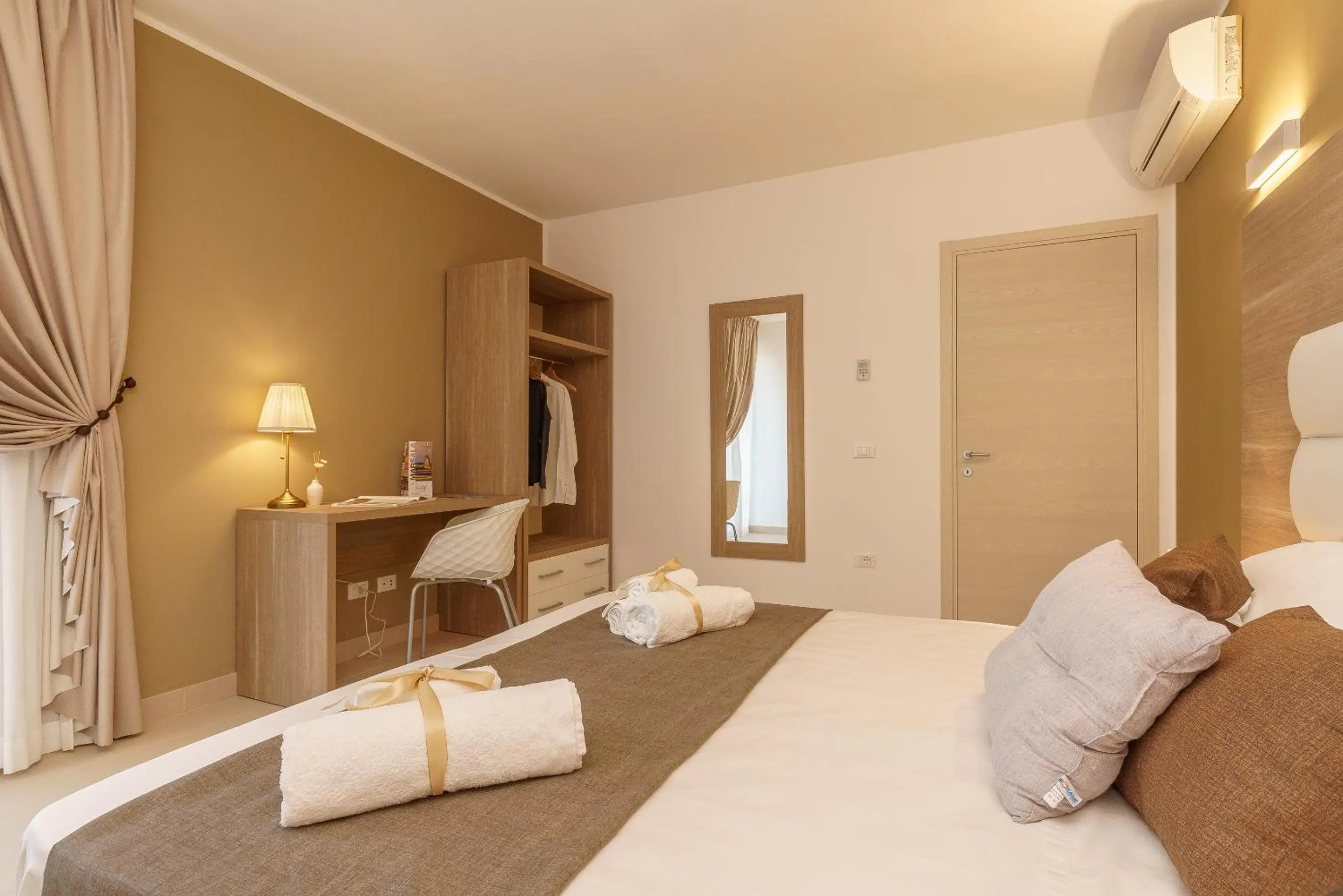 Bed in Travini Hotel Residence