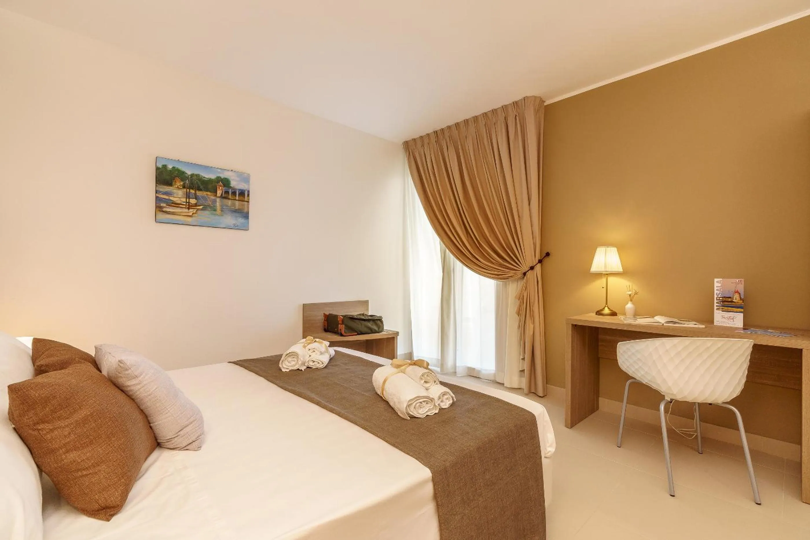 Bed in Travini Hotel Residence