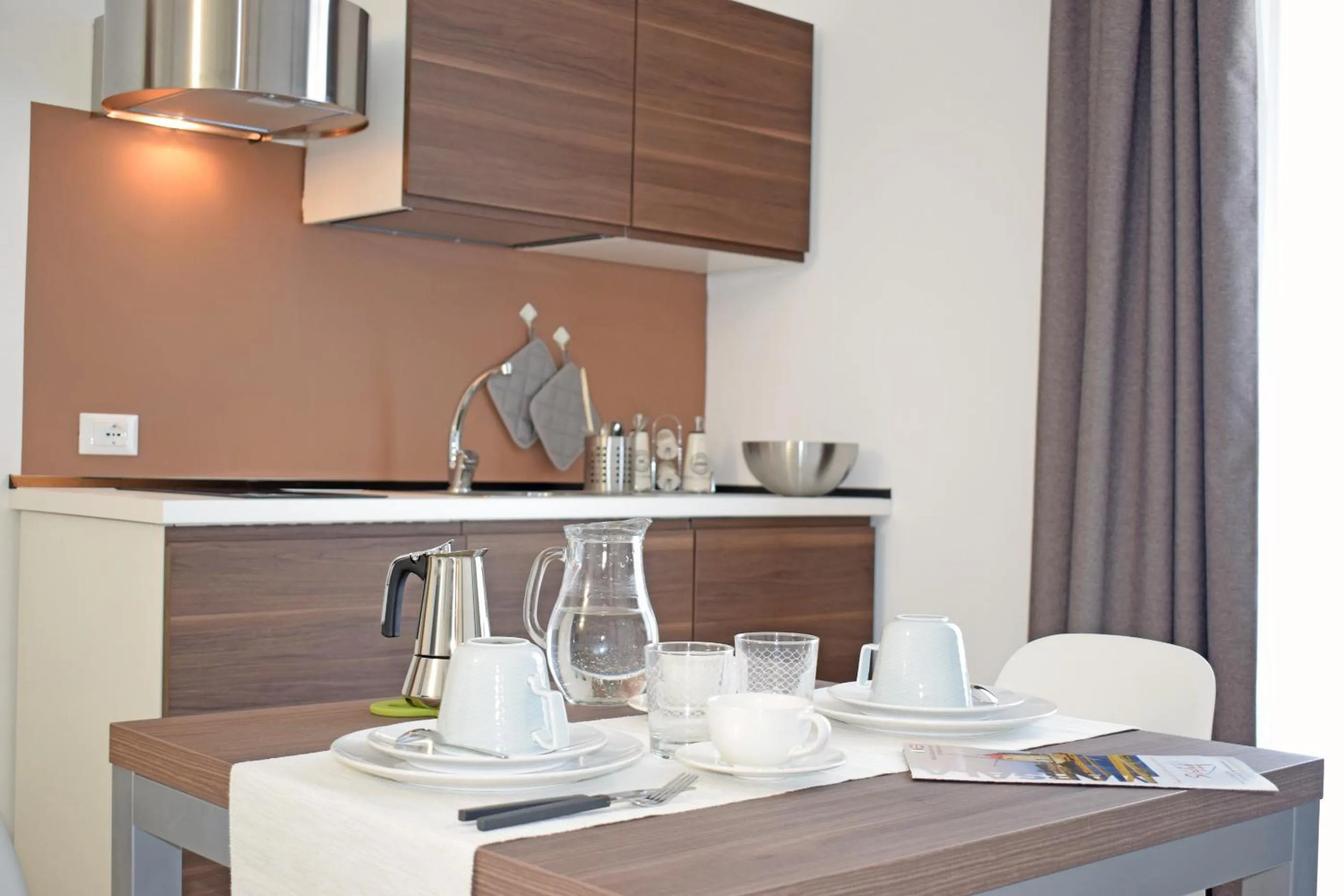 Kitchen or kitchenette in Travini Hotel Residence