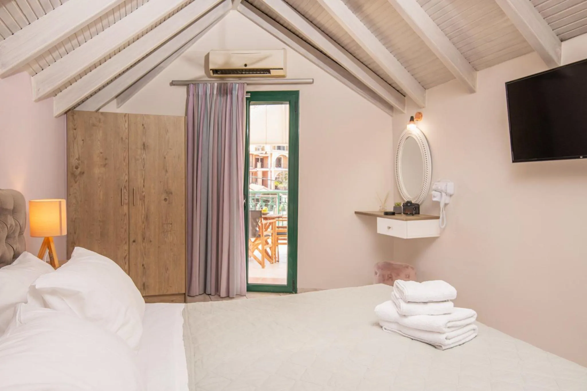 Bed in Koukos Loft Apartments