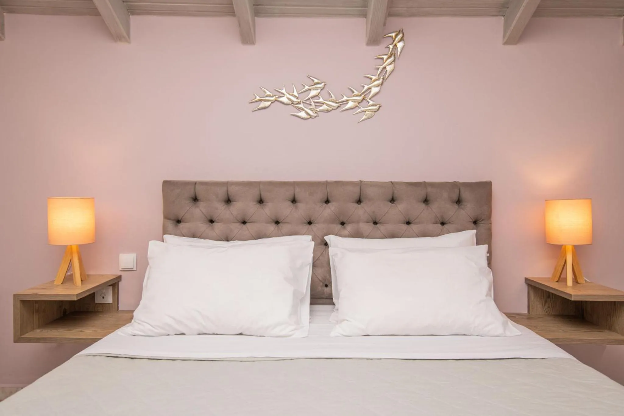 Bed in Koukos Loft Apartments