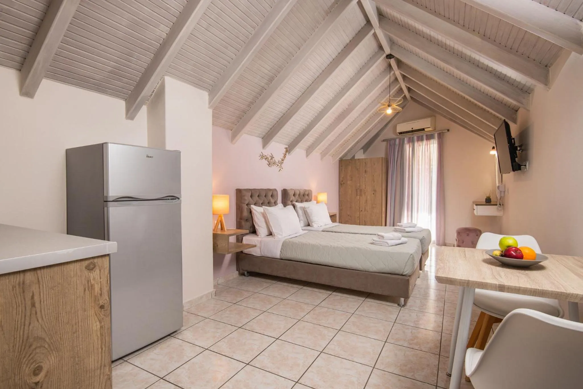 Bed in Koukos Loft Apartments