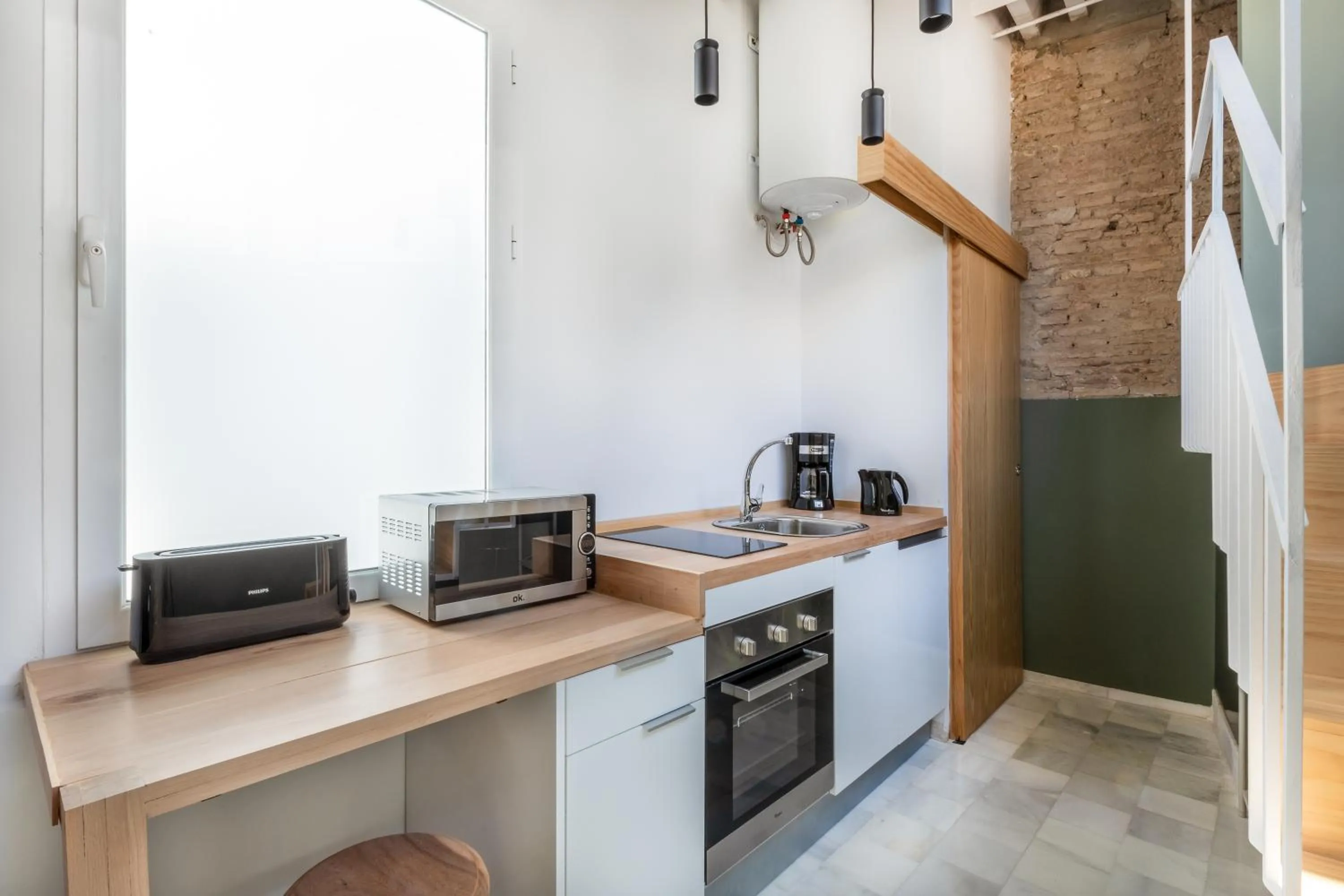 Kitchen or kitchenette in Slow Suites Maestranza