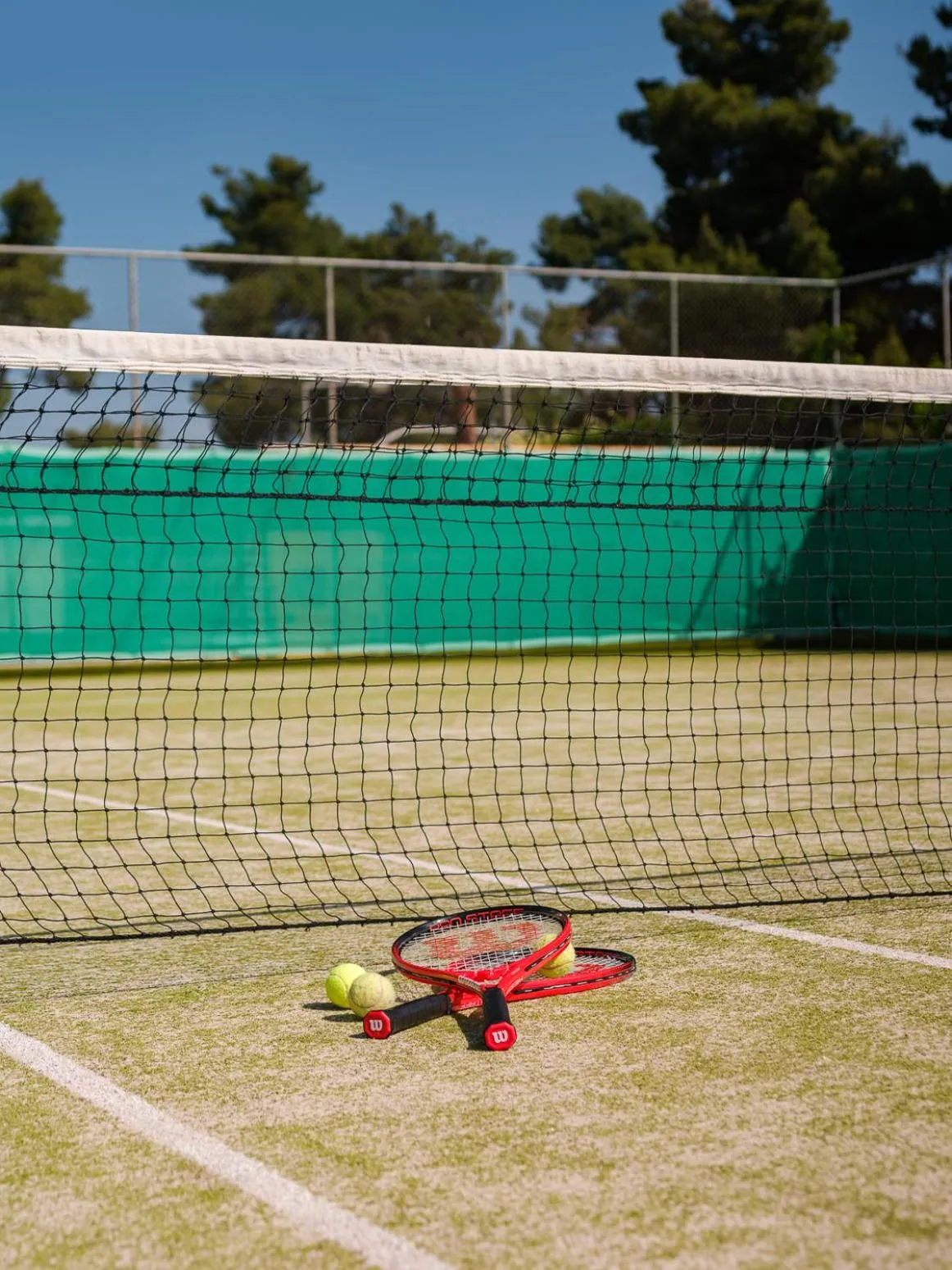 Tennis court in Aegean Melathron Thalasso Spa Hotel