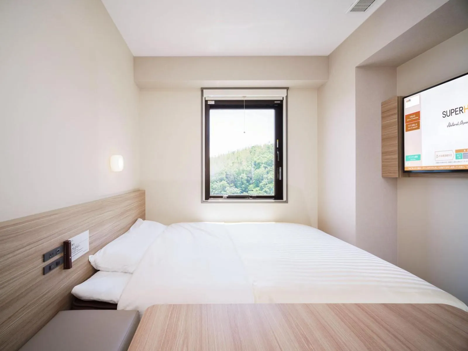 Bed in Super Hotel Anan Tomioka