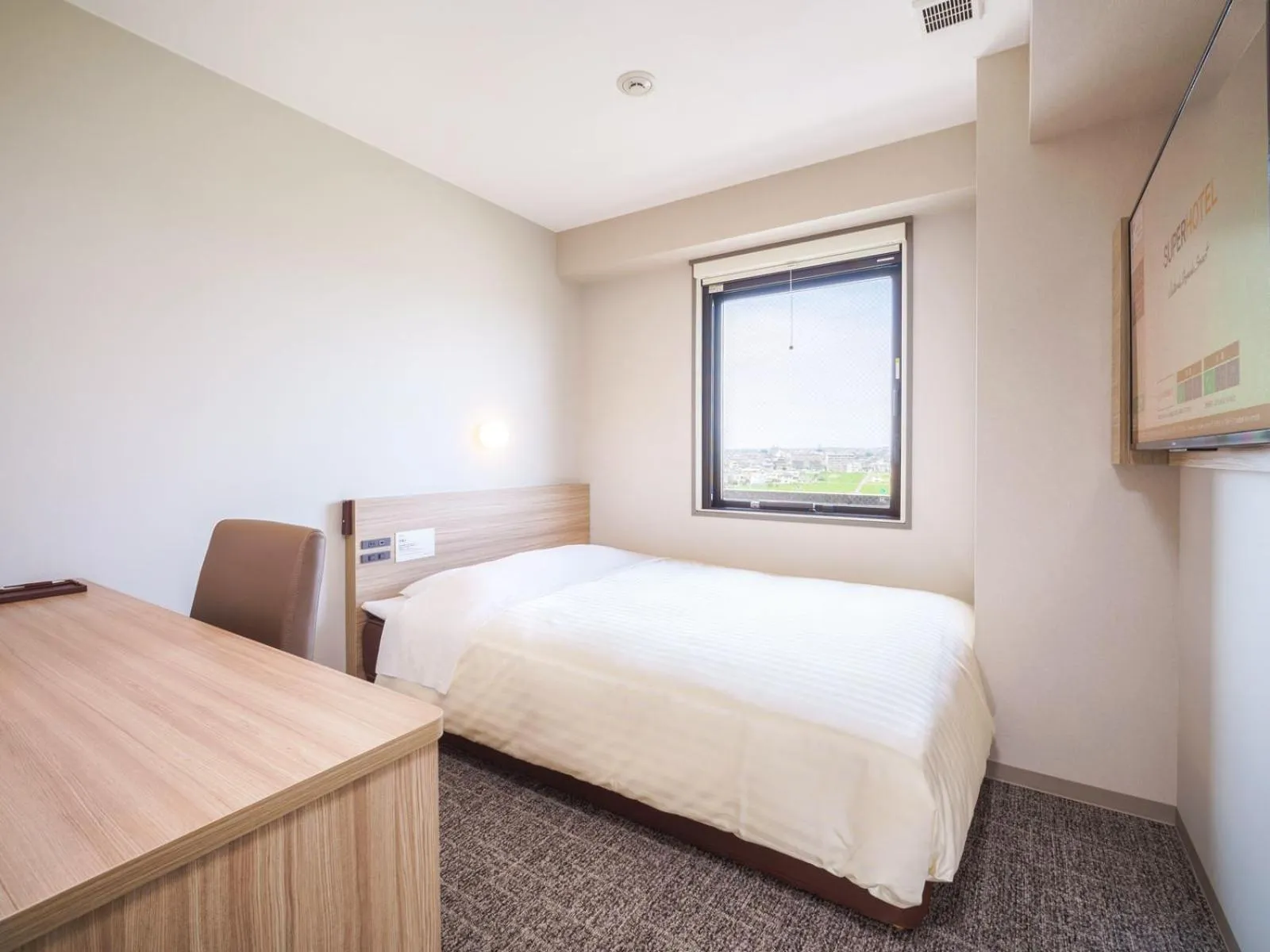 Bed in Super Hotel Anan Tomioka