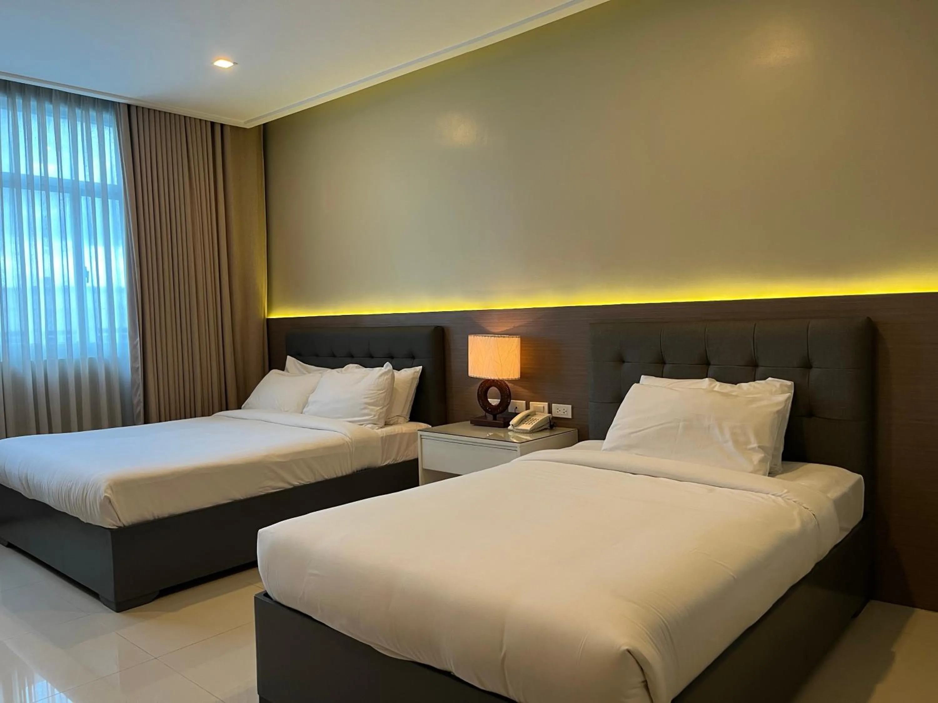 Bed in Iloilo Gateway Hotel and Suites