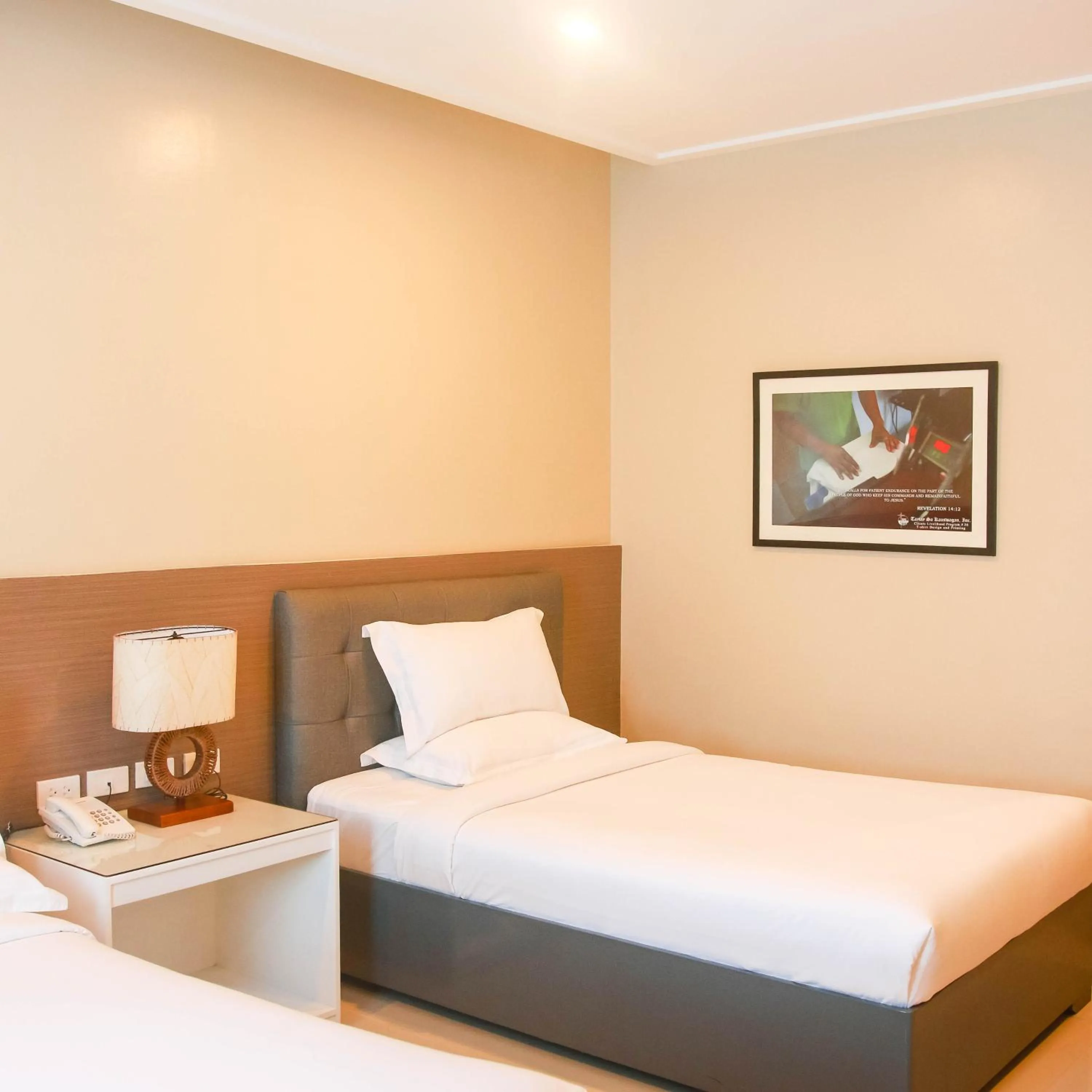 Bed in Iloilo Gateway Hotel and Suites