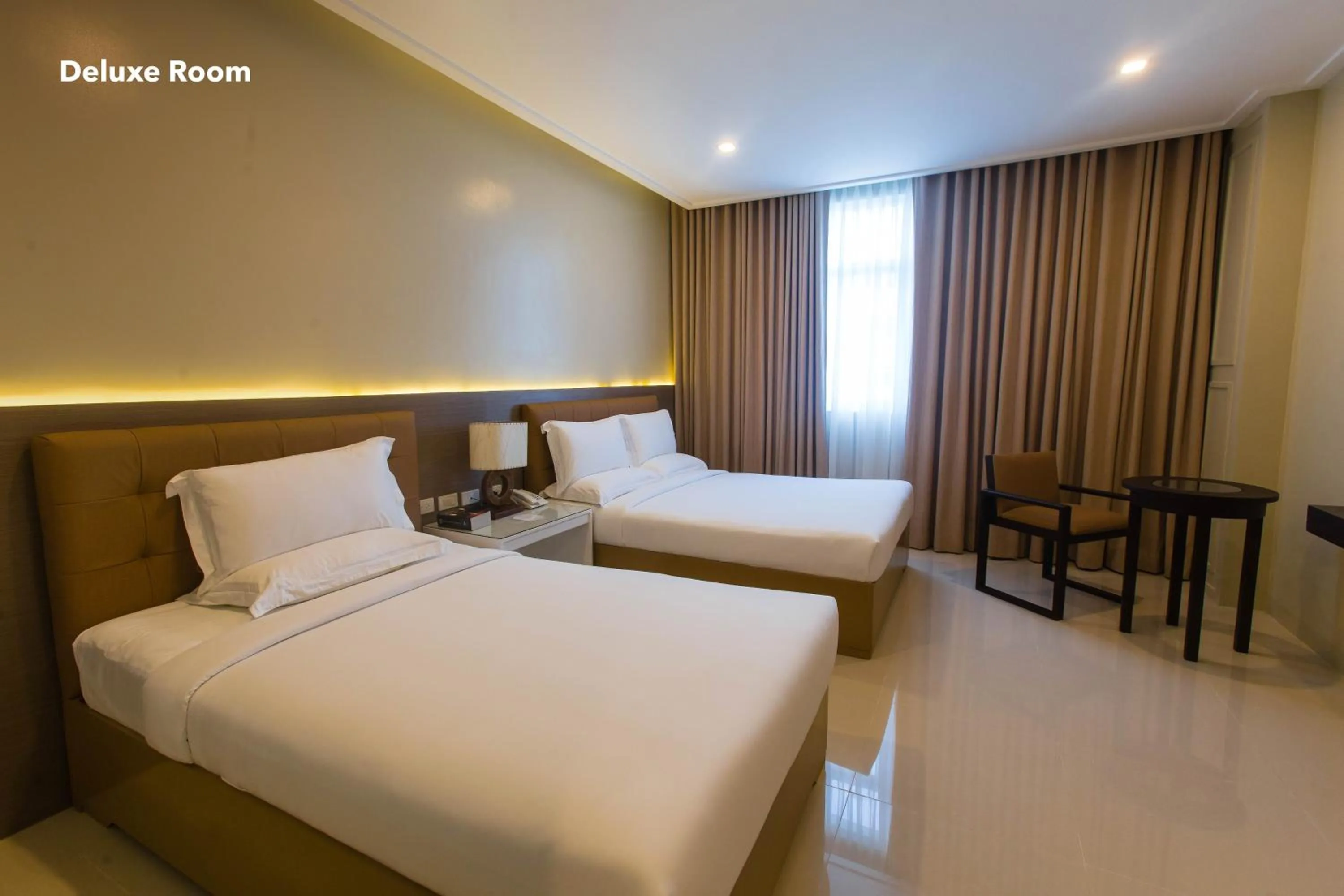 Bed in Iloilo Gateway Hotel and Suites