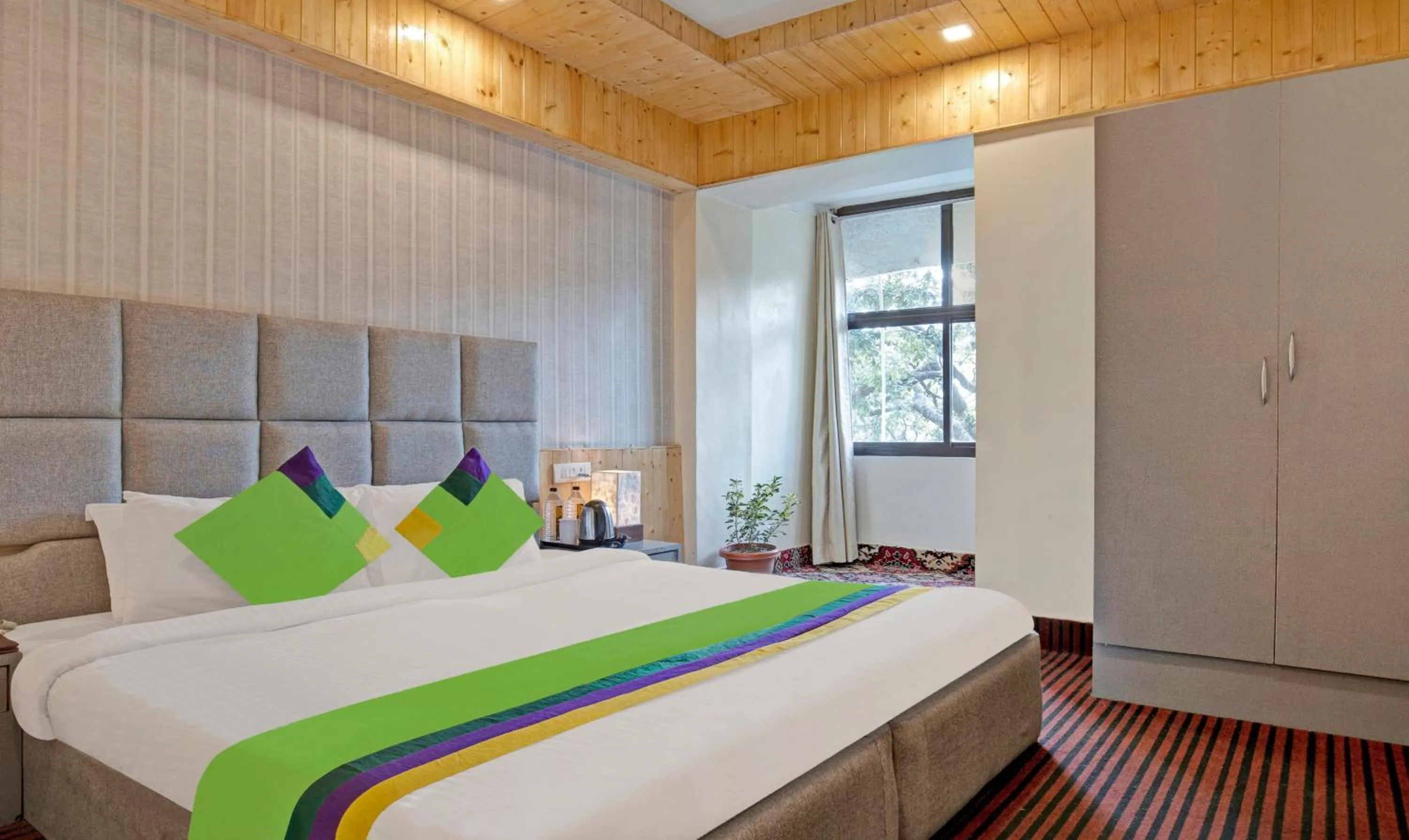 Bedroom in Treebo Kosmos Anamika, 1 Km From Nainital Lake