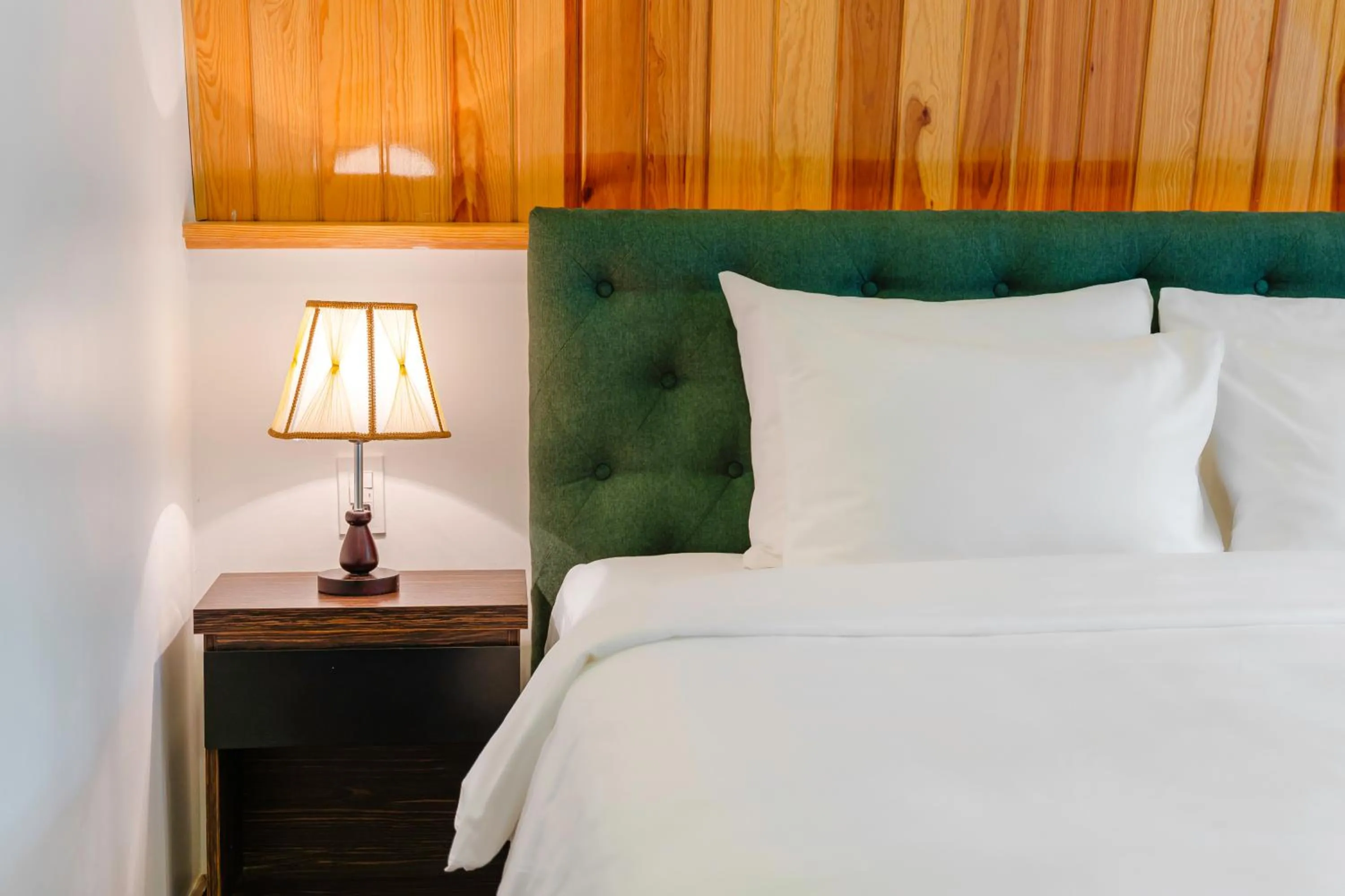 Bed in TTR Moonstone Apart Hotel