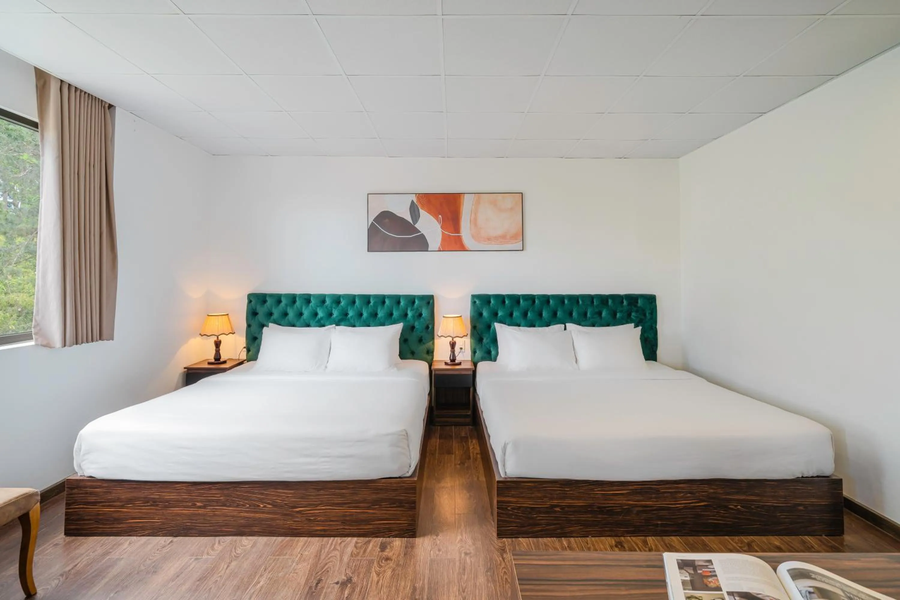 Bed in TTR Moonstone Apart Hotel