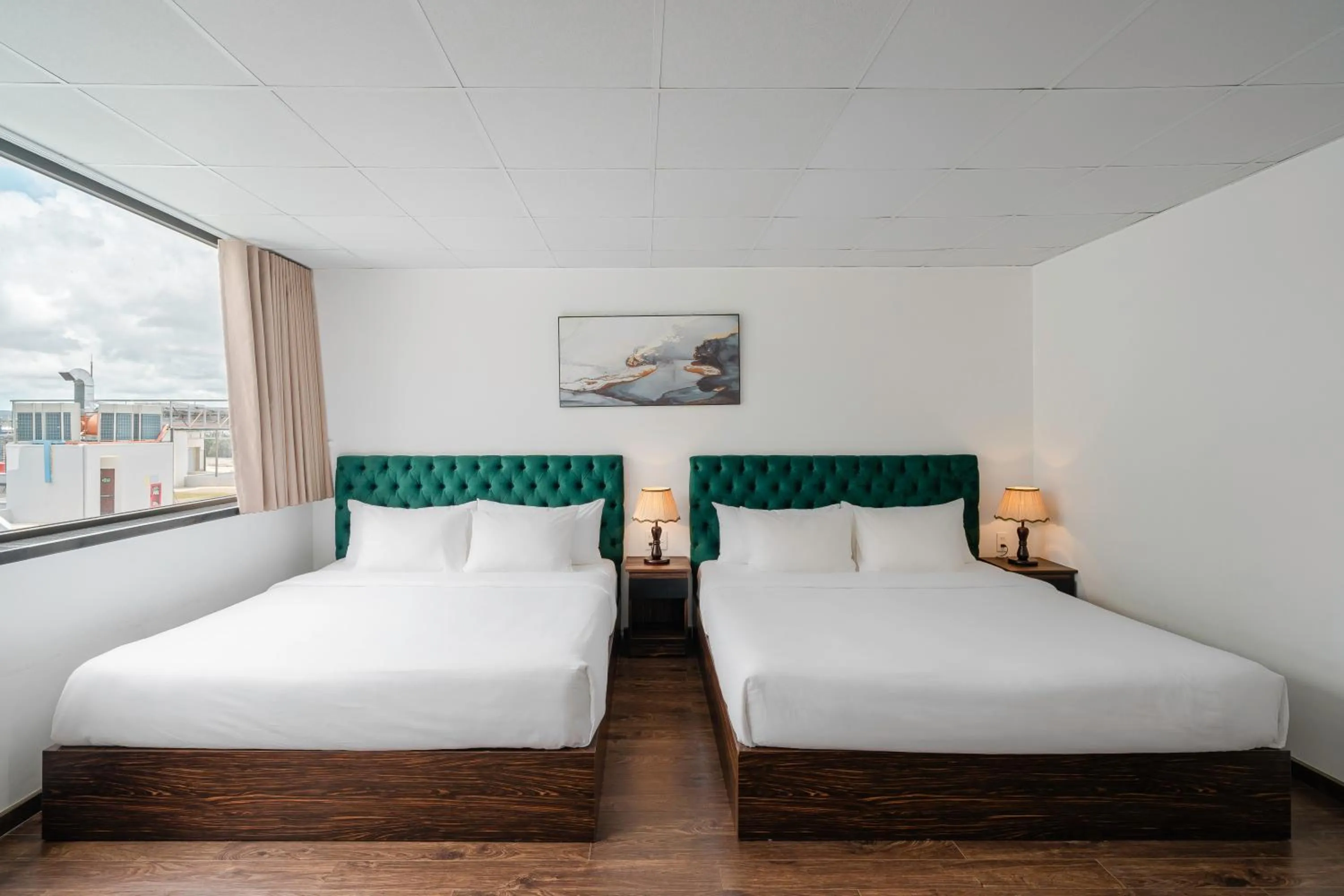 Bed in TTR Moonstone Apart Hotel