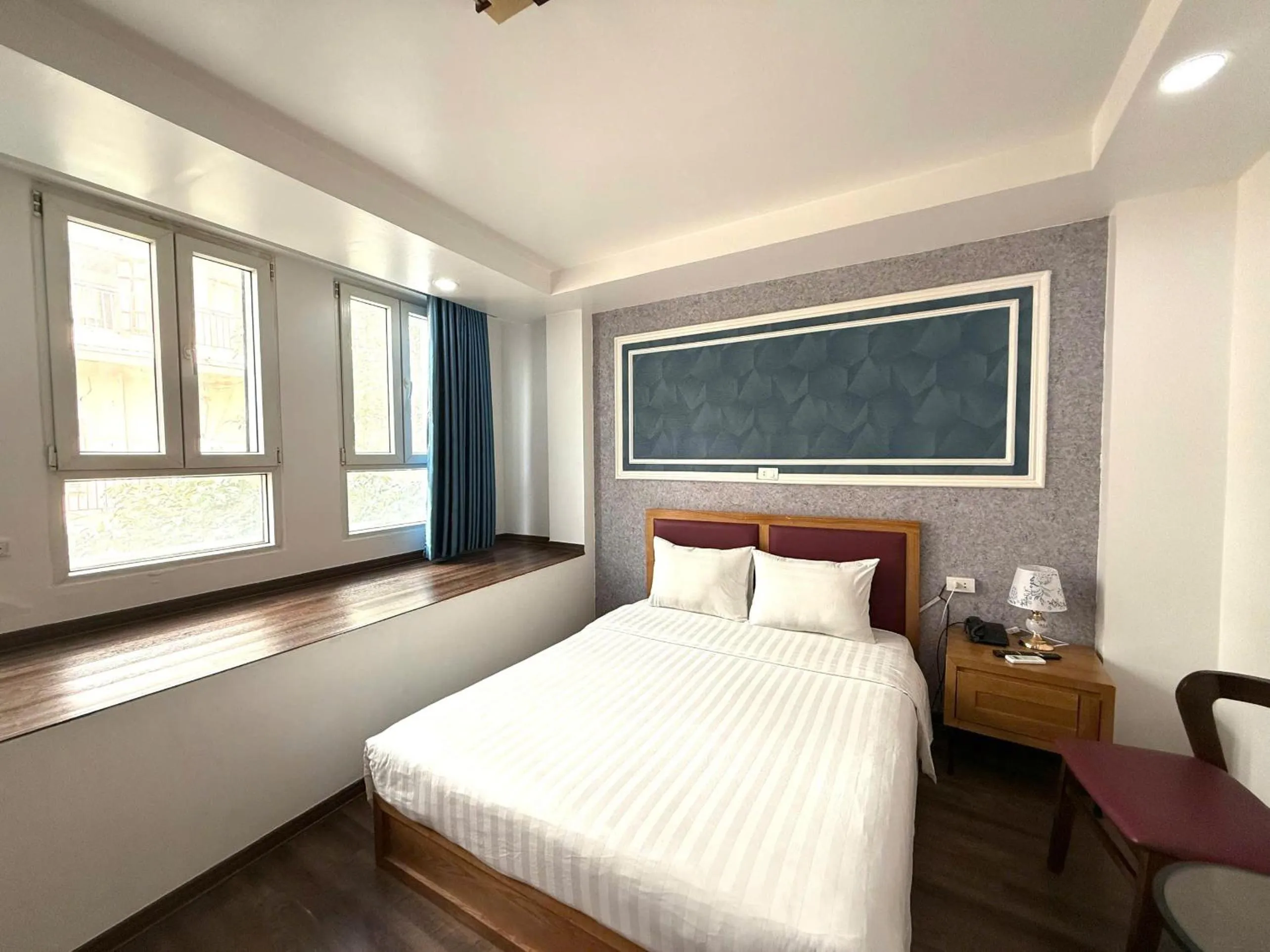 Bed in Holiday Suites Hotel & Spa