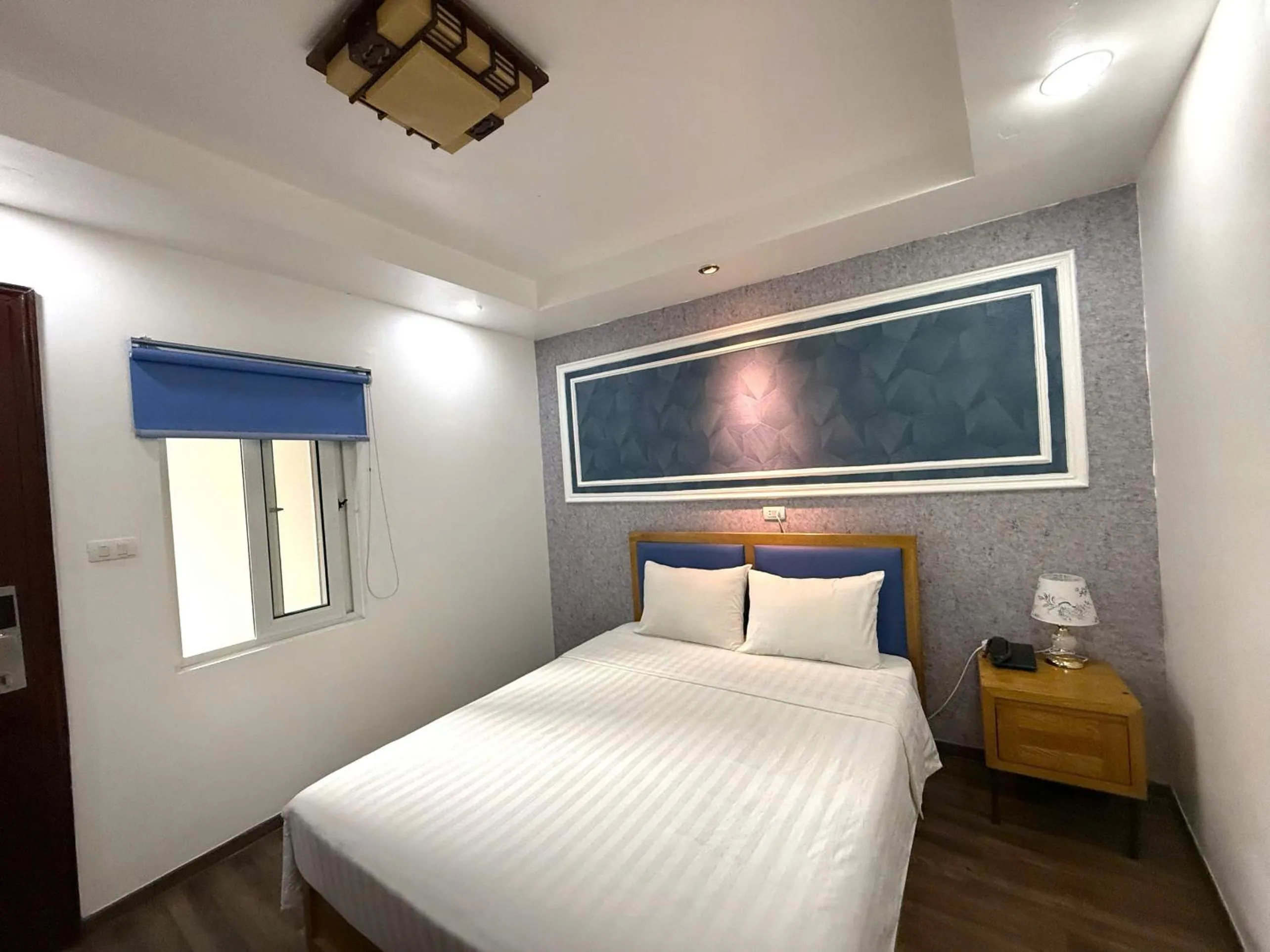 Bed in Holiday Suites Hotel & Spa