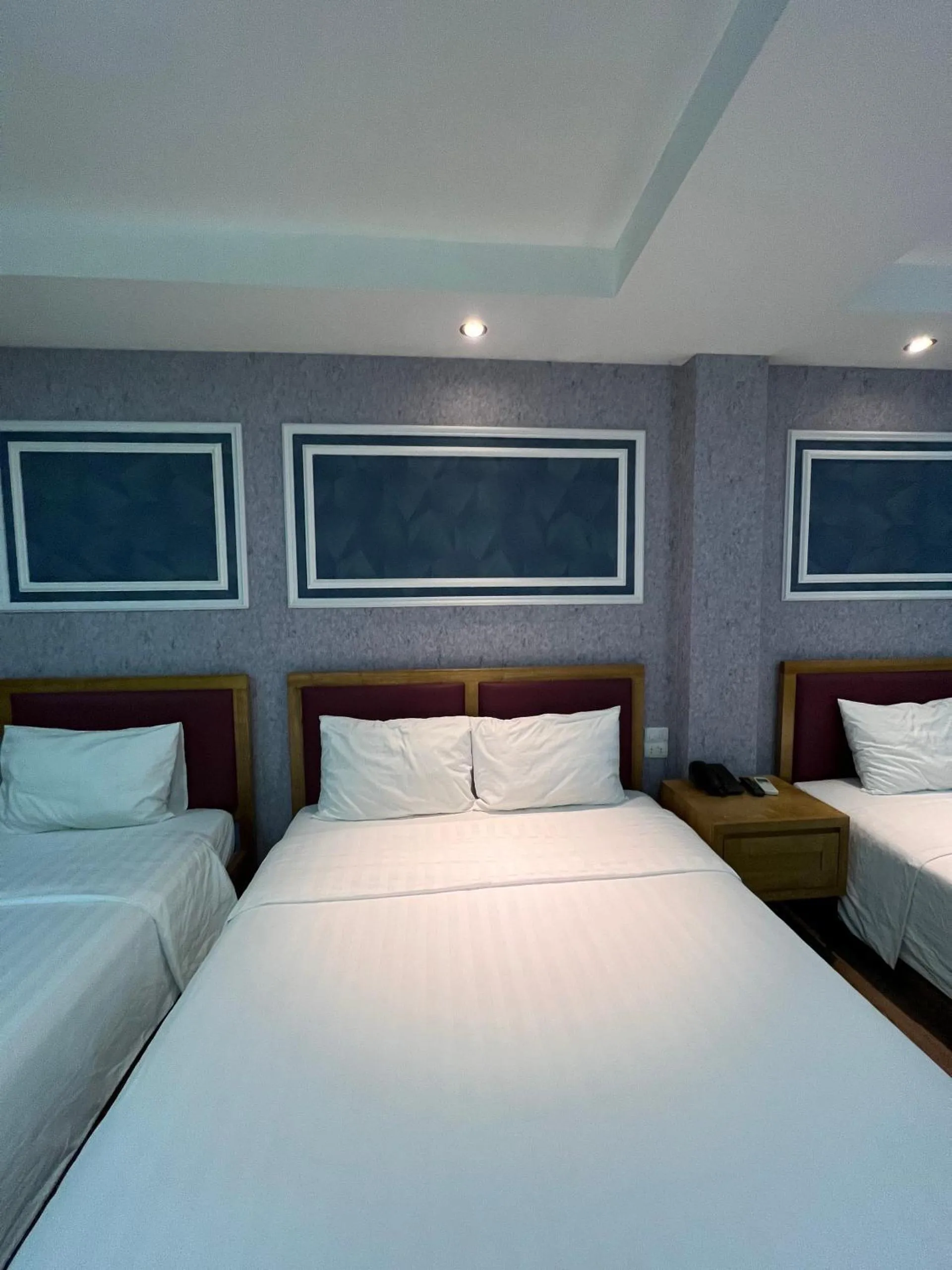 Bed in Holiday Suites Hotel & Spa