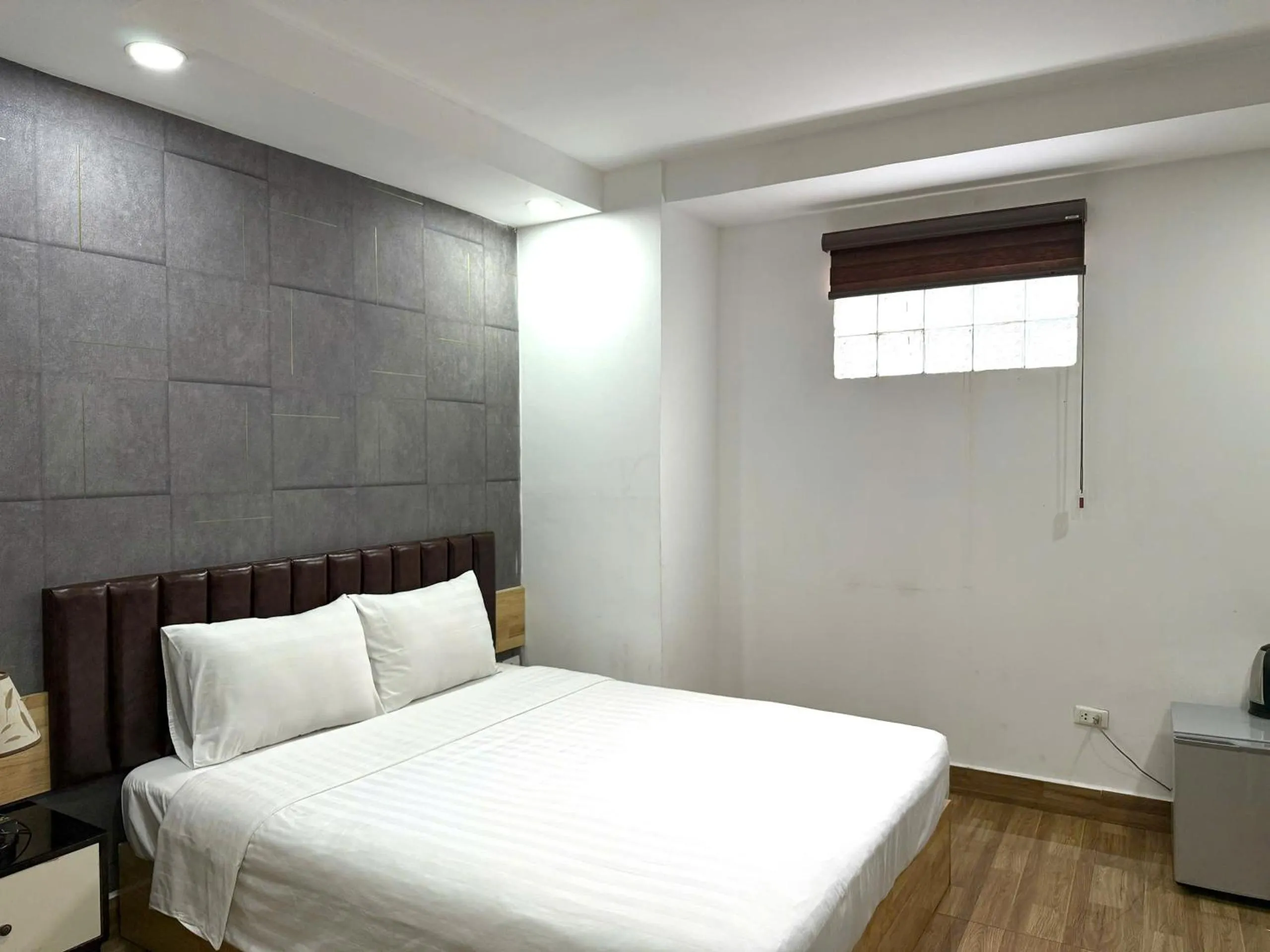 Bed in Holiday Suites Hotel & Spa