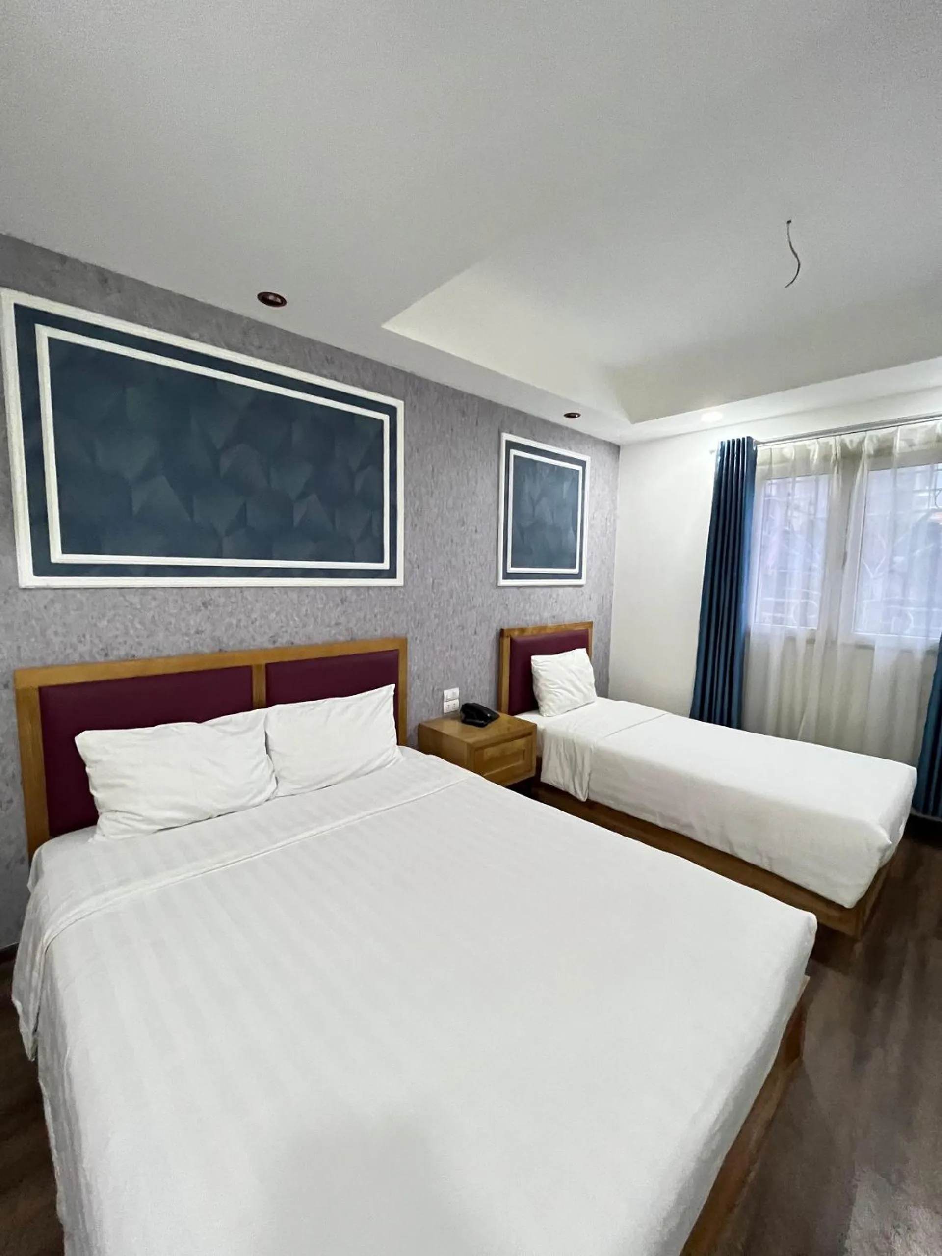Bed in Holiday Suites Hotel & Spa
