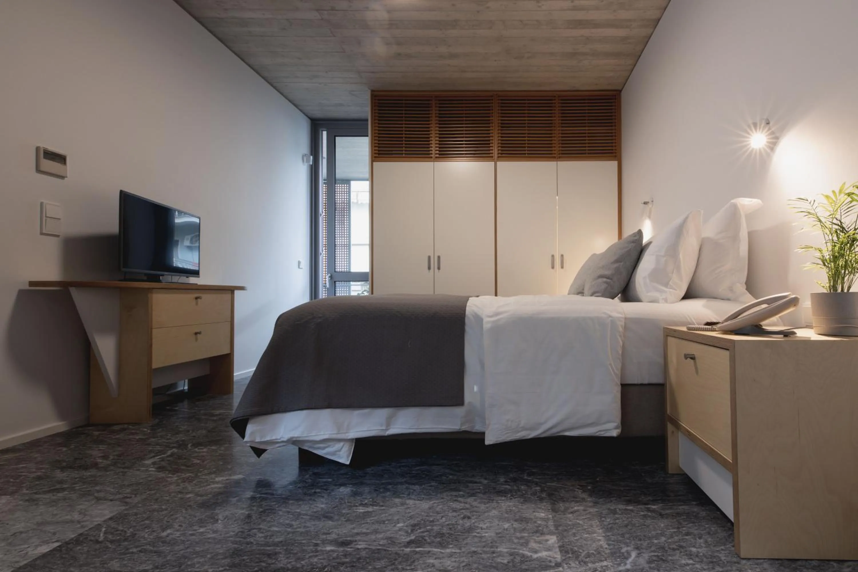 Photo of the whole room, Bed in Athens BlueBuilding