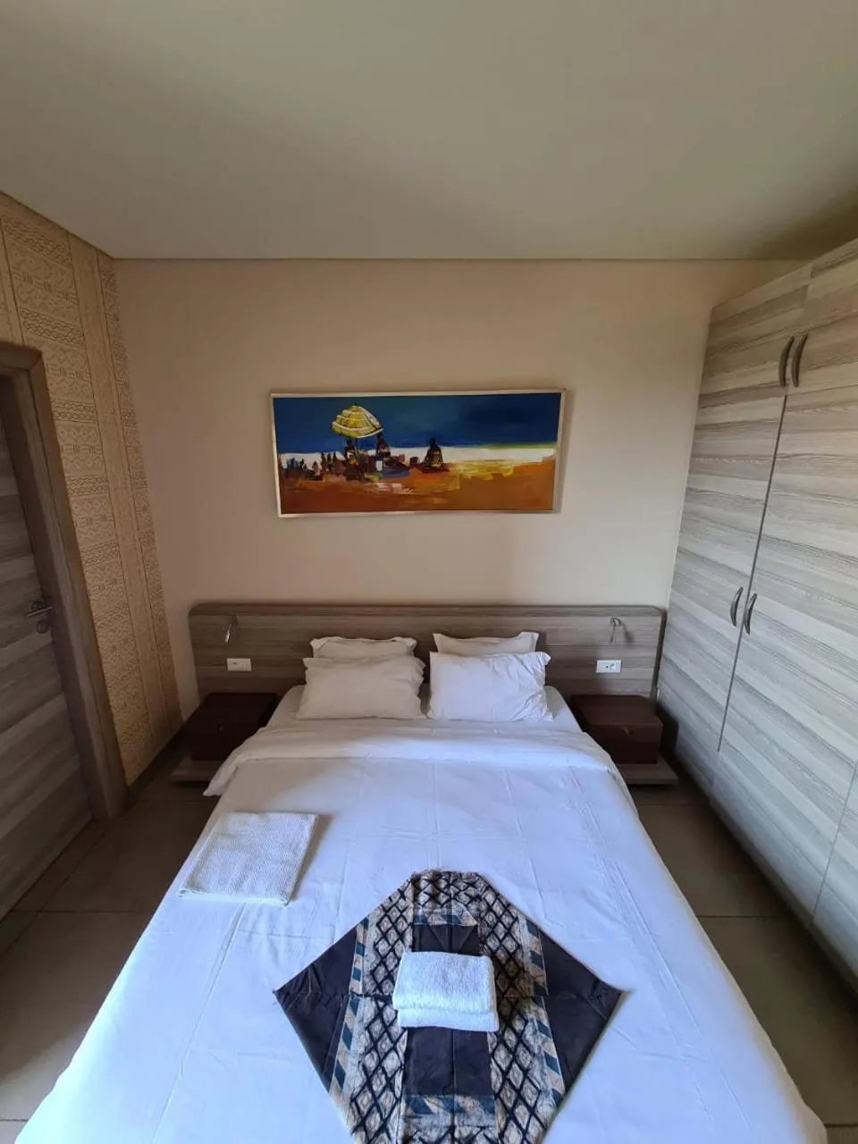 Bed in Roots Hotel Apartments Abidjan