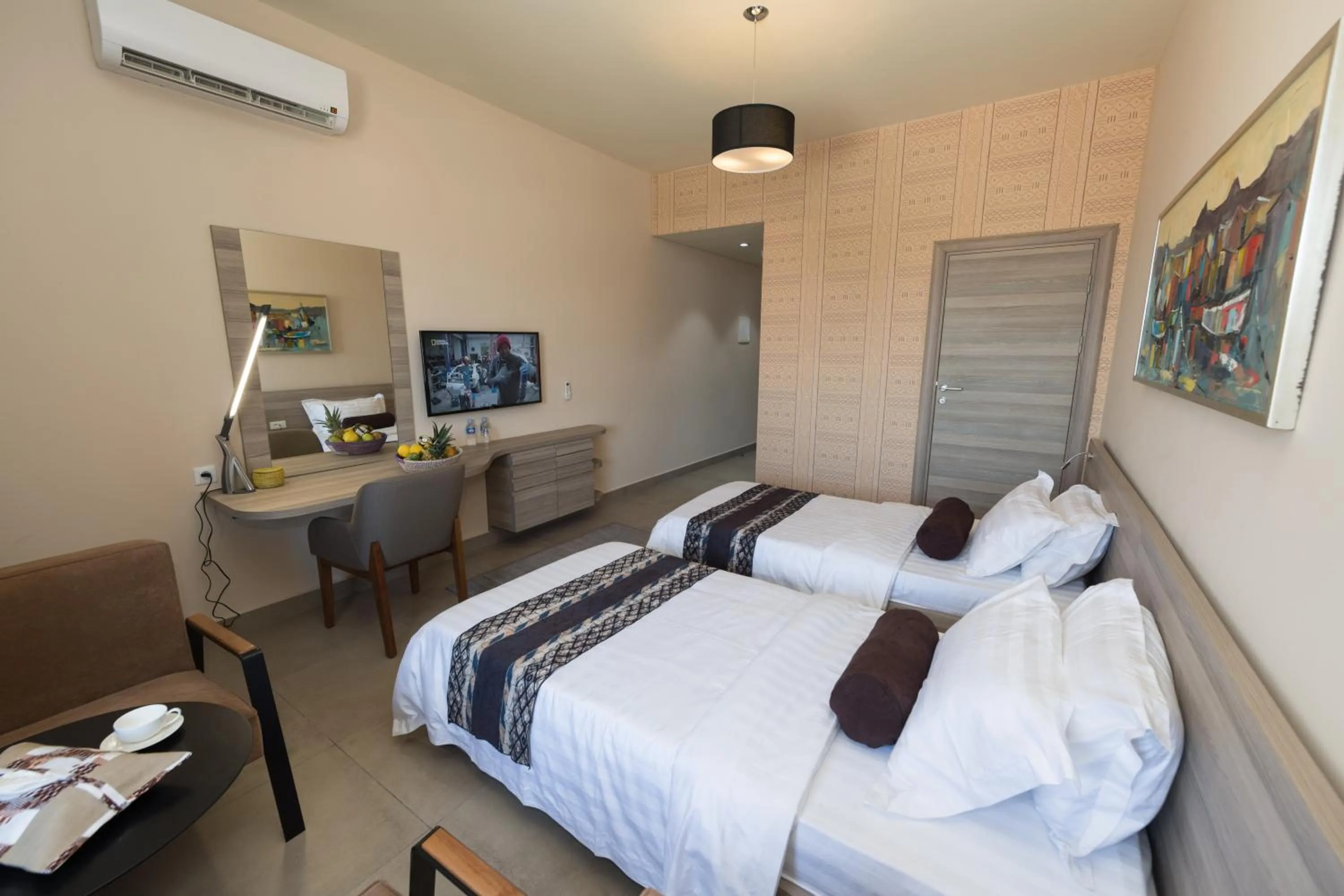 Bed in Roots Hotel Apartments Abidjan