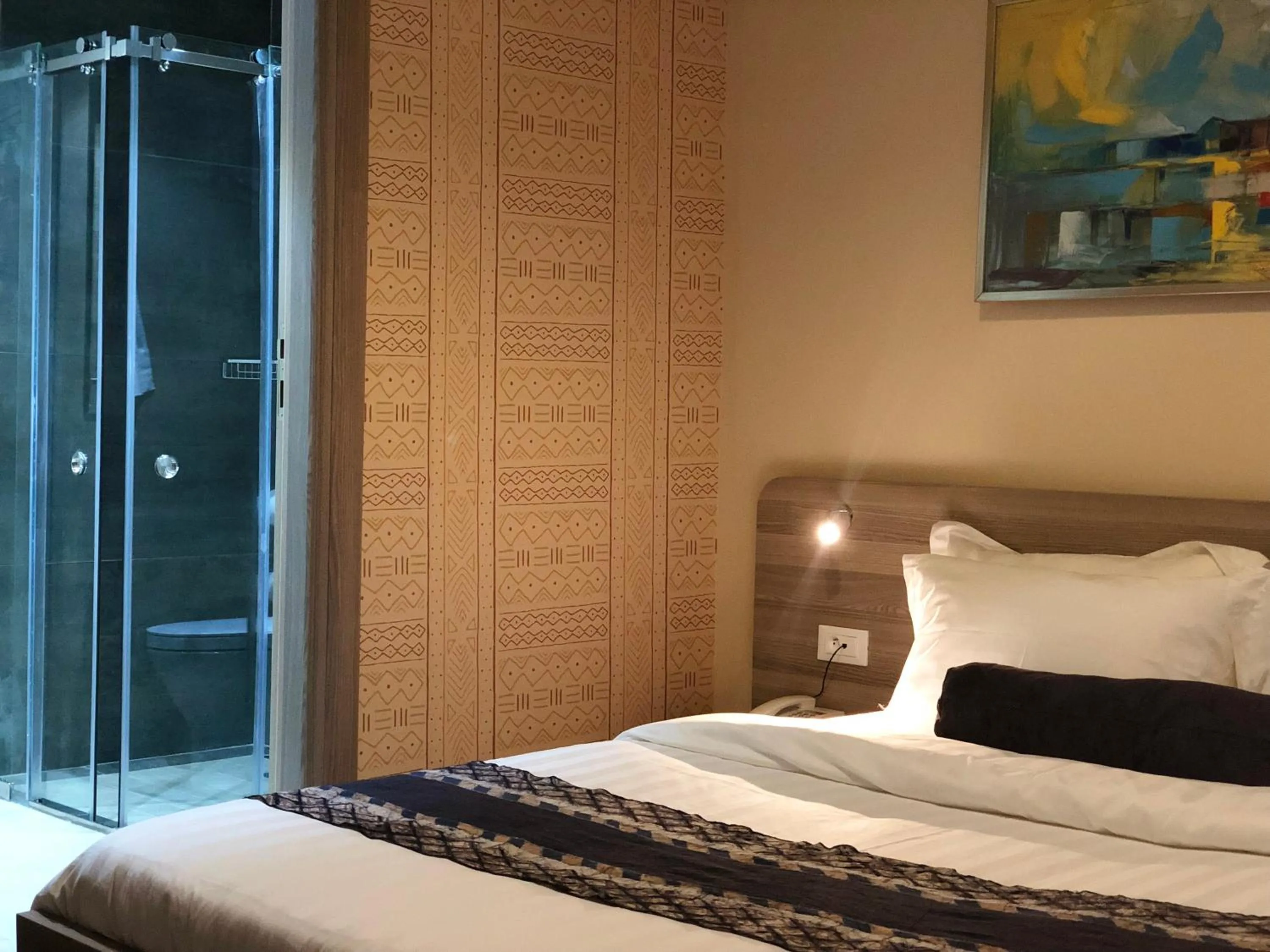 Bed in Roots Hotel Apartments Abidjan