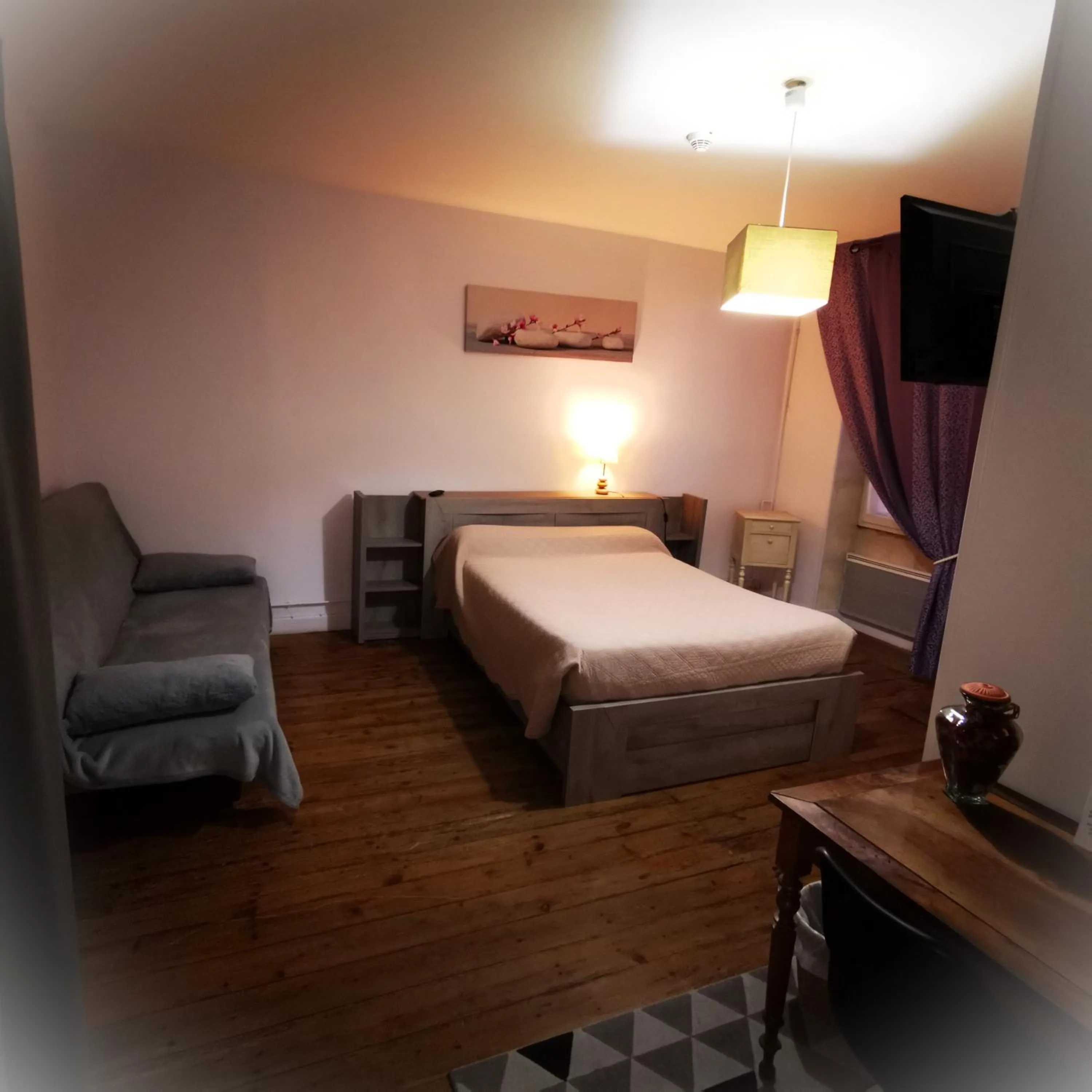 Bed in Logis Hôtel & Restaurant Le Saint Savinien