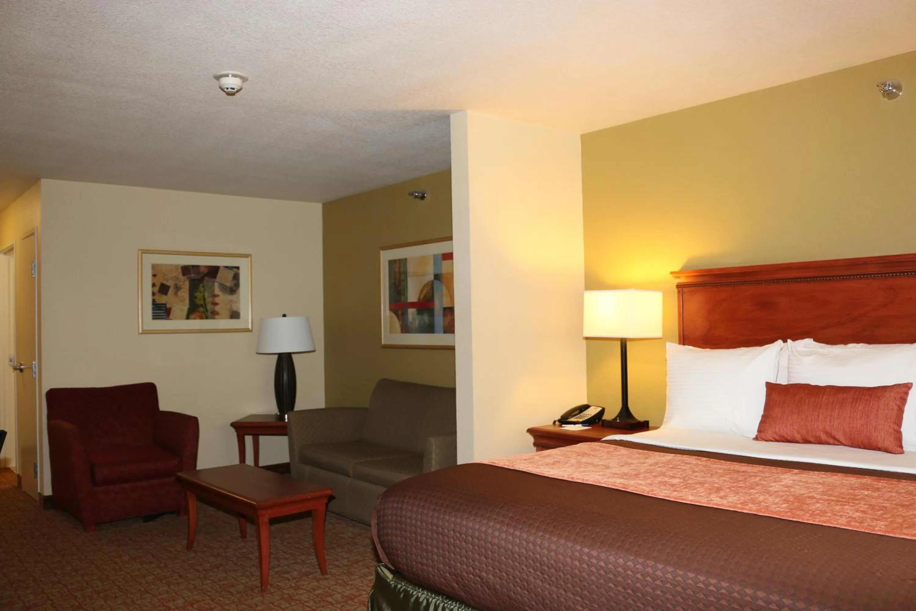 Bed in Heritage Hotel and Suites