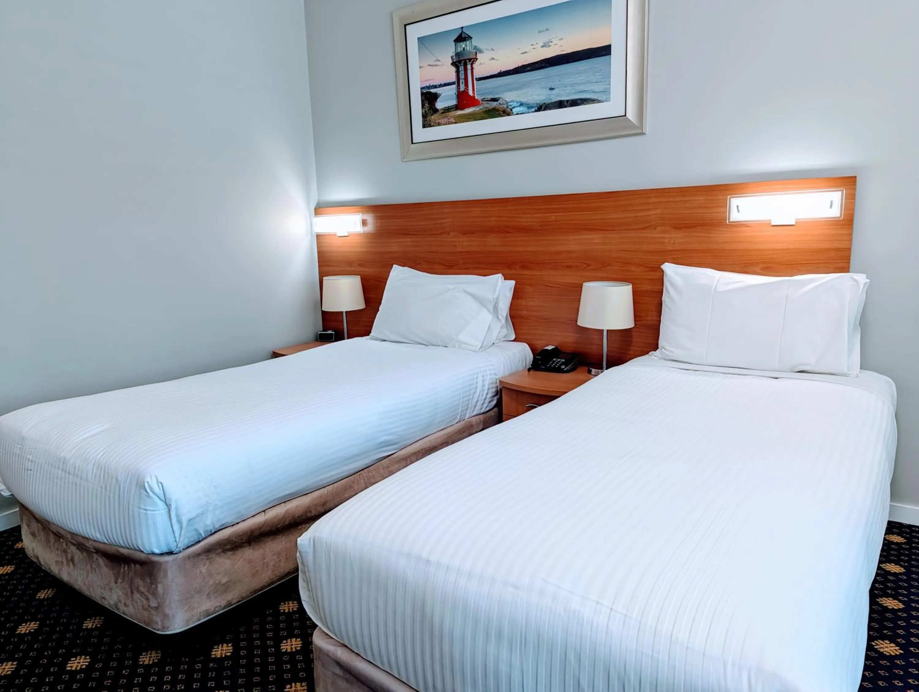 Bed in Ramada Hotel & Suites by Wyndham Cabramatta