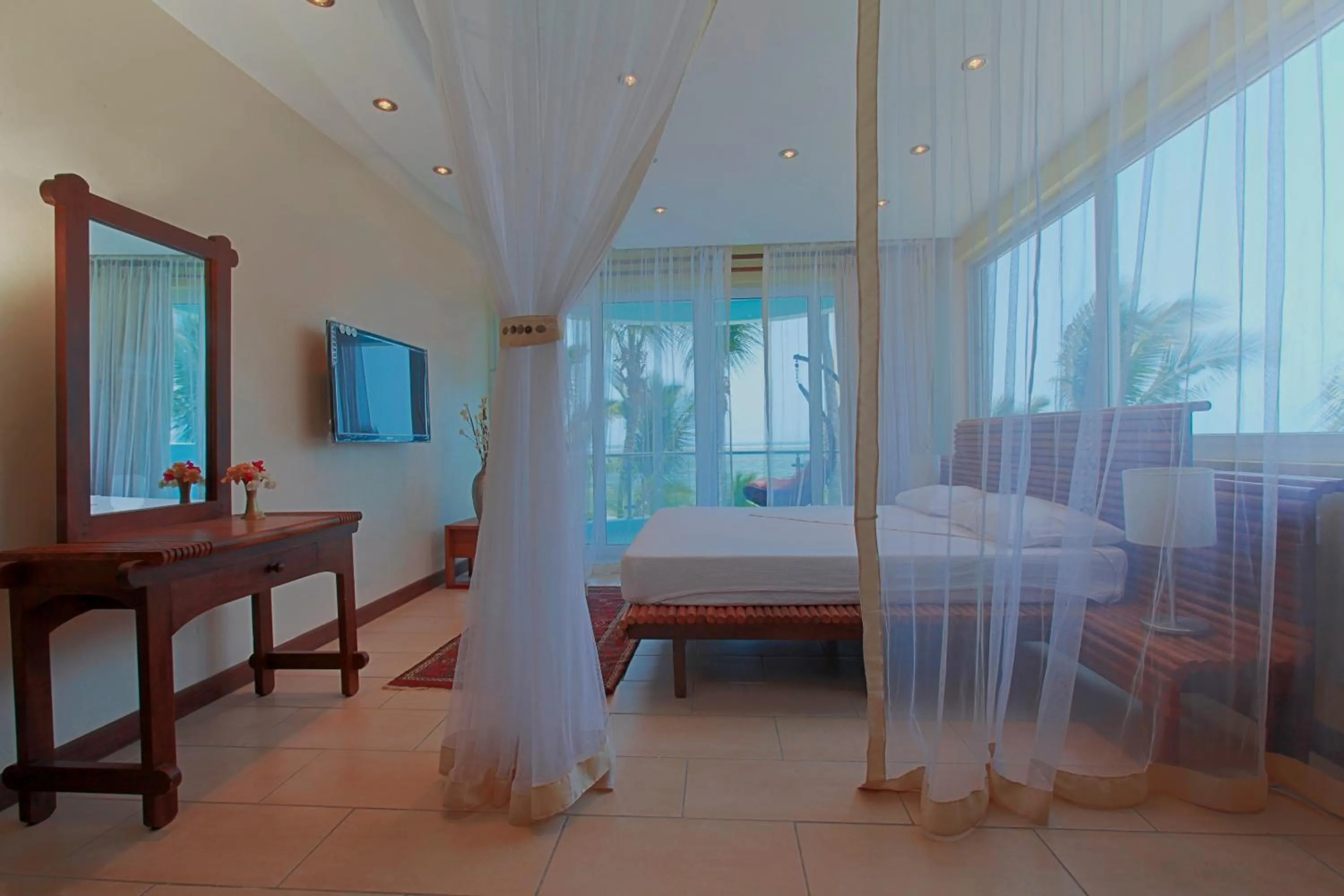 Photo of the whole room, Bed in Cowrie Shell Beach Apartments Official